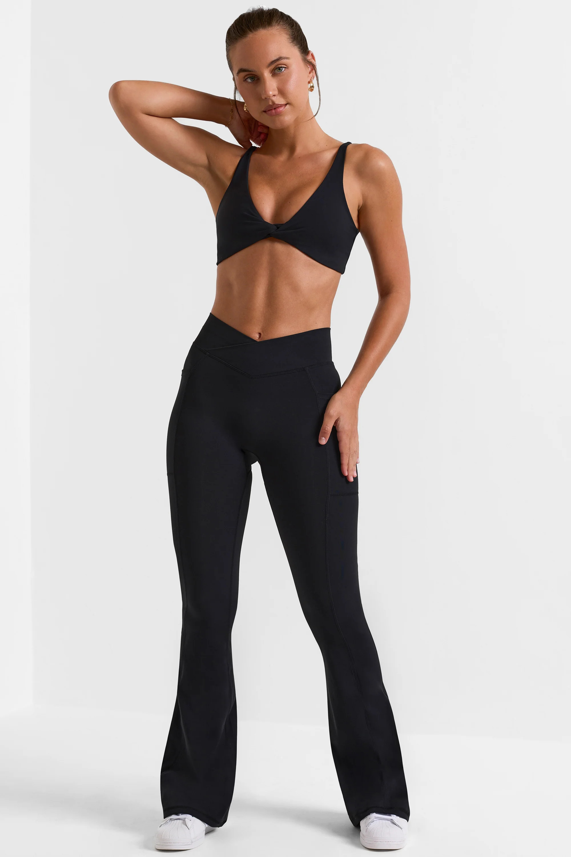 Match - Cross Waistband Flare Pocket Leggings in Black | Bo+Tee