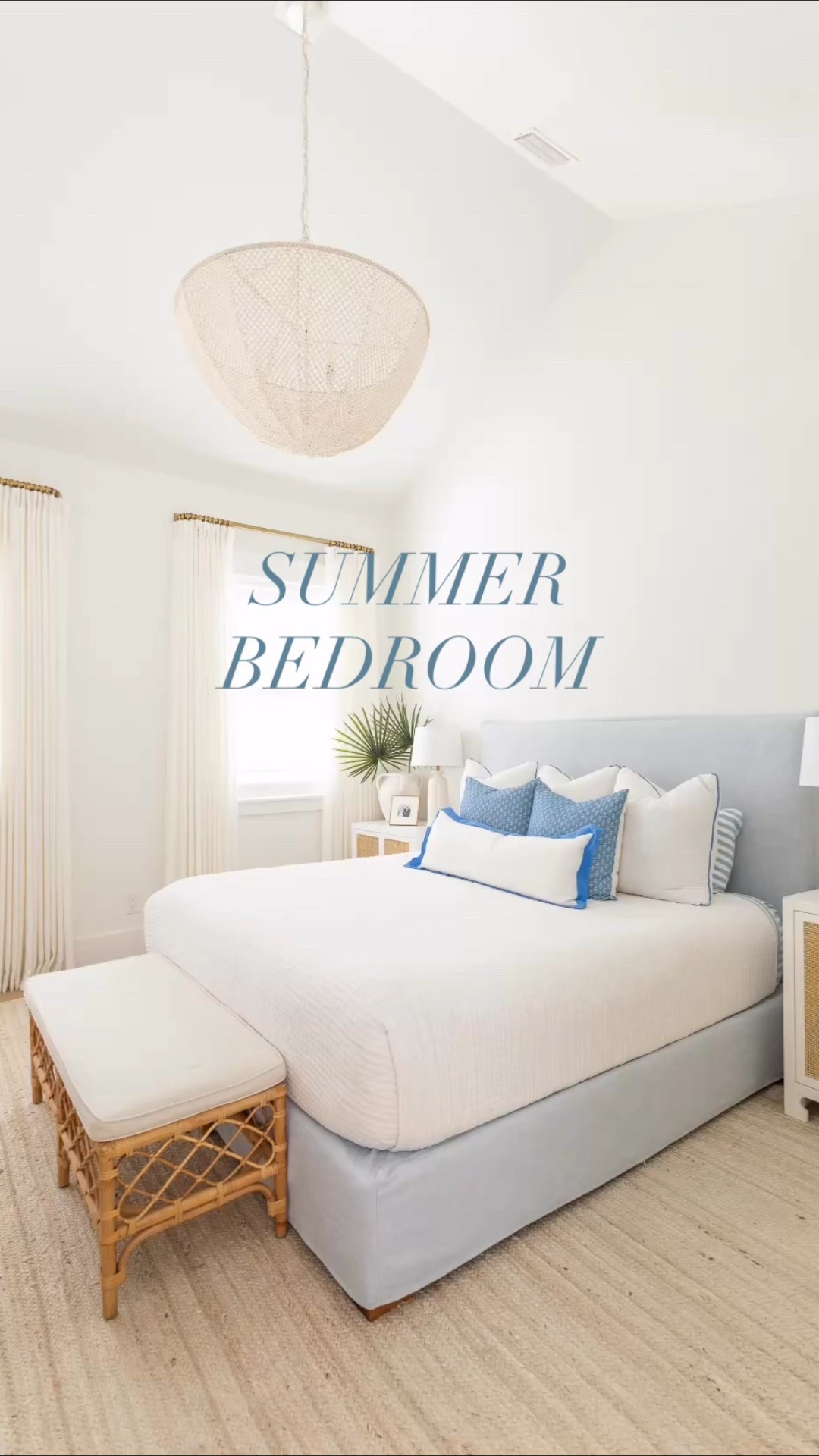 Our bedroom decorated for summer with white and blue bedding, a light blue linen bed frame, rattan bench, pinch pleat drapes, wood bead chandelier, my favorite faux fan palms, lily pad art, off-white jute rug, rattan nightstands and block print accent pillows.  #ltkhome #ltkfindsunder50 #ltkfindsunder100 #ltkstyletip #ltkseasonal #ltksalealert Amazon home finds, Amazon drapes, coastal design 

#LTKHome #LTKSaleAlert #LTKSeasonal