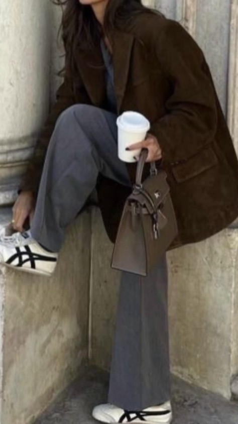 A brown suede blazer with grey pants and sneakers creates a refined yet relaxed look for fall. The mix of tailored and casual pieces feels effortlessly modern, while the warm brown and cool grey tones balance each other for a polished, understated finish. 

 #LTKSeasonal #LTKActive #LTKStyleTip