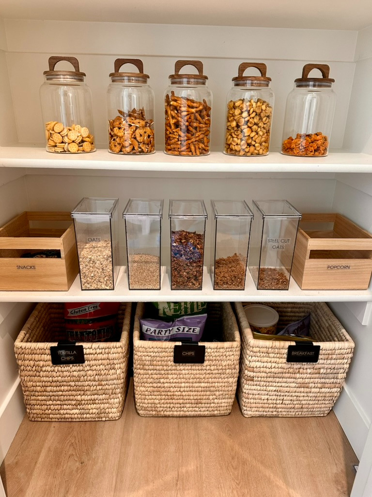 Clear with black accents and a little texture gives this pantry a sleek, classy look. #OrganizeWithTracy #Pantryorganization #organizesimply 

 #LTKHome #LTKFamily