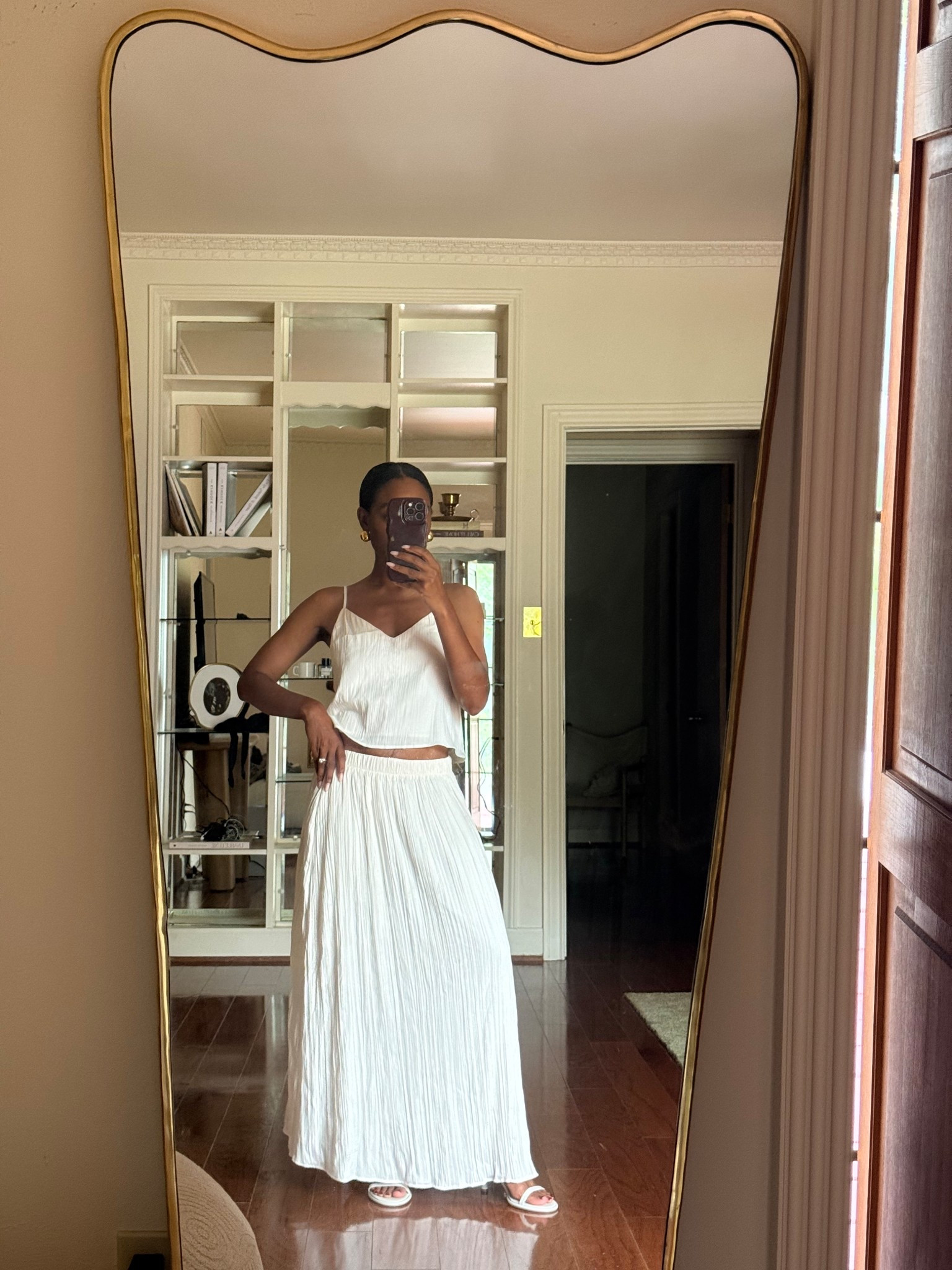 Cream plisse tank and maxi skirt set (sold as separates), gold oversized ball earrings, and white strappy sandals 

#LTKStyleTip #LTKShoeCrush