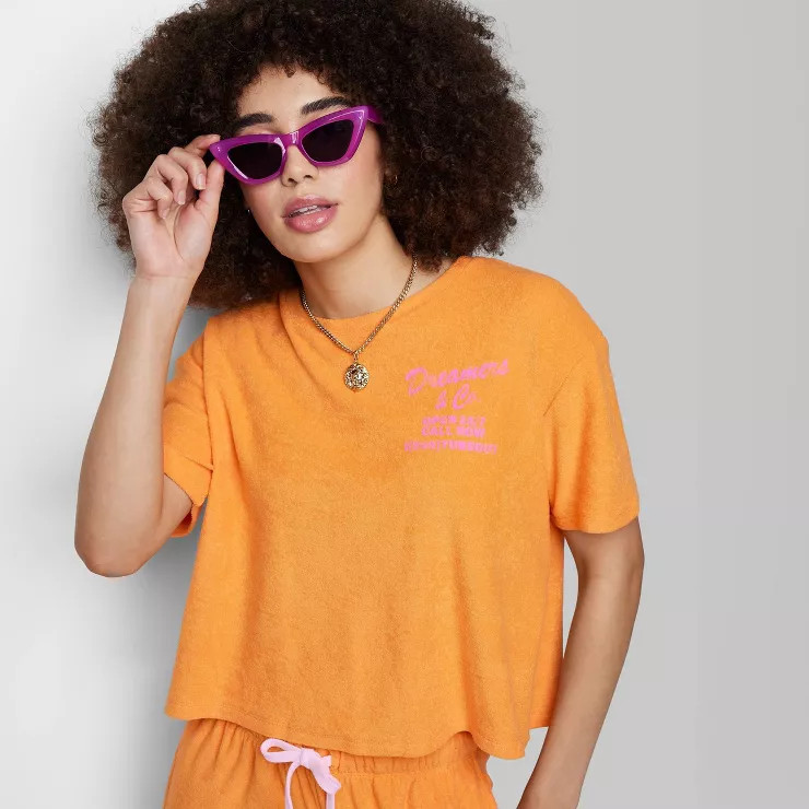 Women's Ascot + Hart Dreamers and Co. Short Sleeve Graphic T-Shirt - Orange | Target