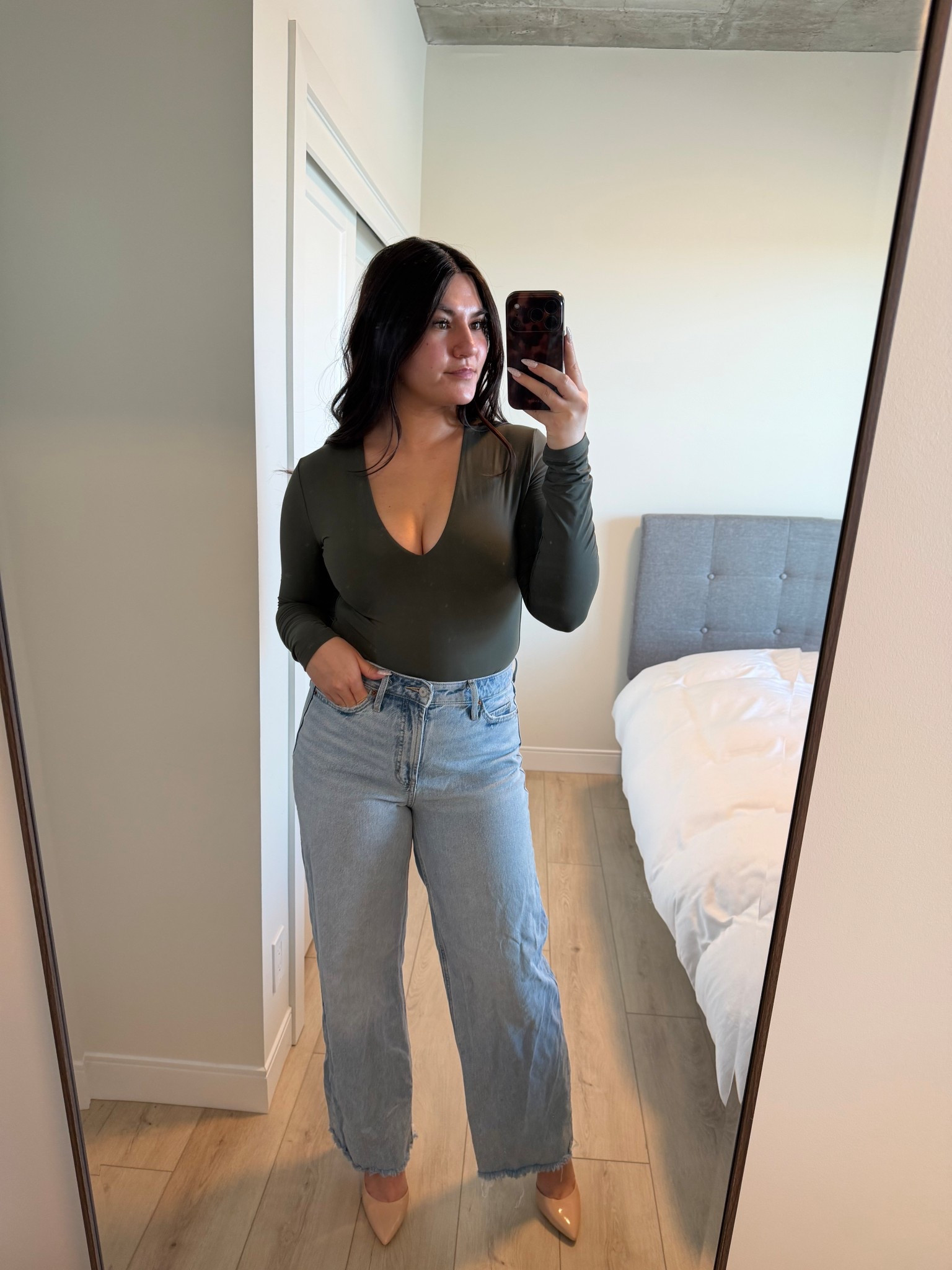 I’m wearing the bodysuit in size M and jeans in size 6 for reference 