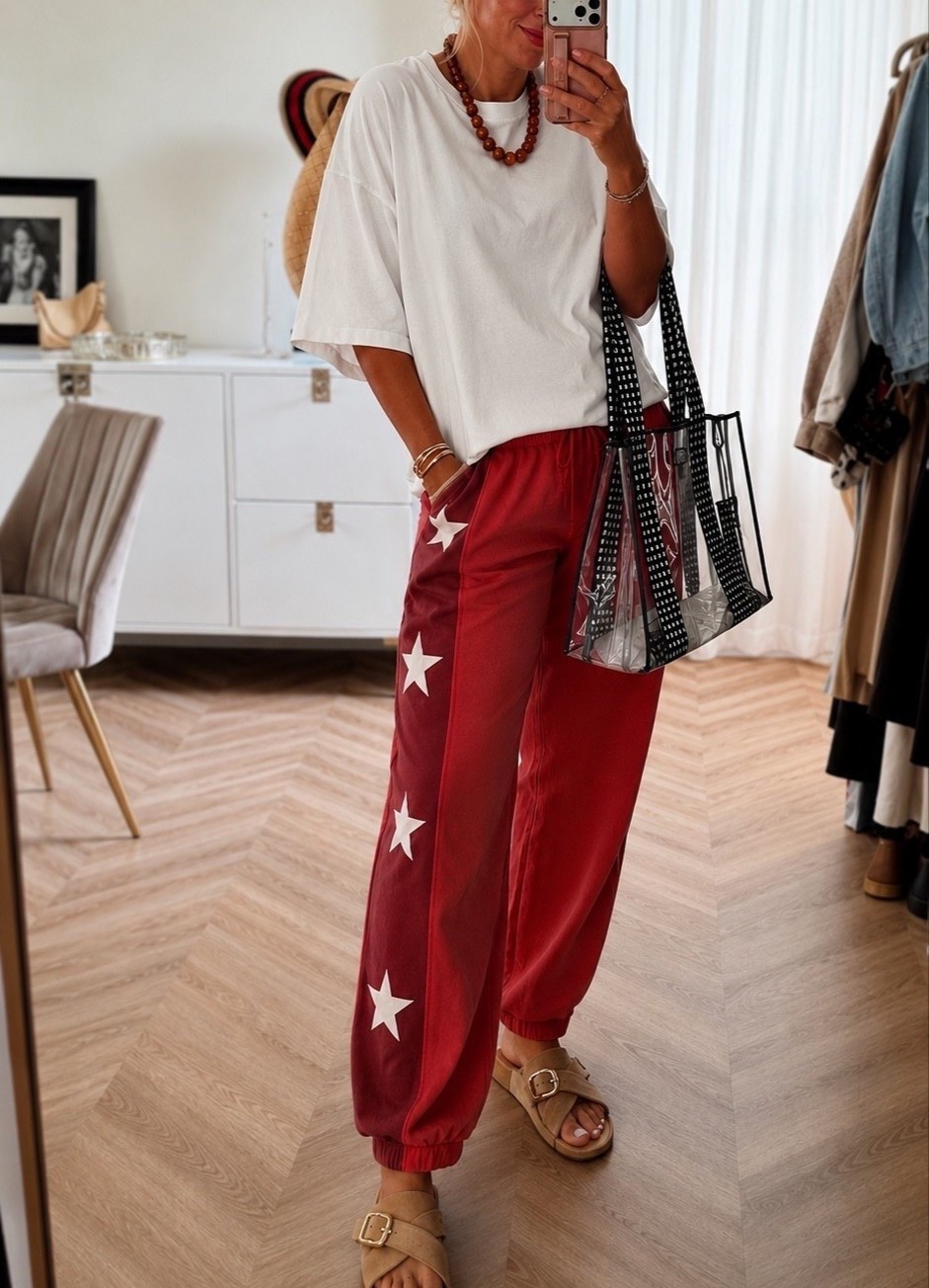 These new FP-inspired star sweats had me at first glance ⭐️❤️ The perfect relaxed fit for errands, travel days, or cozy mornings, and they’re so easy to style with an oversized tee and sandals. Such a fun statement piece for summer!

Star sweatpants. Free People inspired. Lounge outfit. Casual outfit. Travel outfit. Everyday style. Oversized tee. Summer outfit. Comfy fashion. Athleisure.

#LTKootd #LTKSeasonal