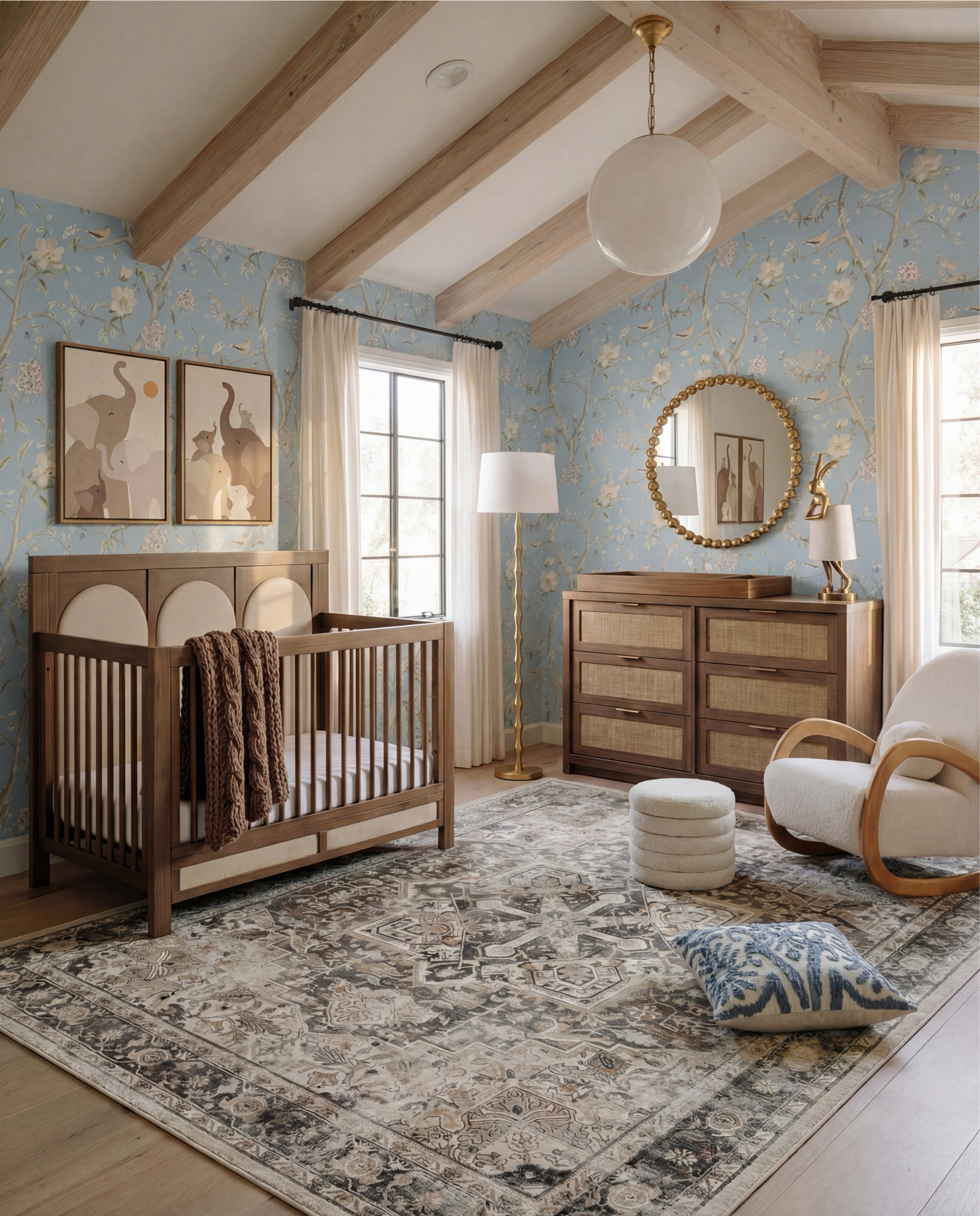 This nursery feels soft, whimsical, and thoughtfully layered—designed to grow with your little one while still feeling elevated and calm. The powder blue floral wallpaper sets a dreamy backdrop, while light wood beams and furniture keep the space warm and grounded. Natural textures, rounded shapes, and gentle curves make the room feel cozy, playful, and serene all at once.

The styling is sweet but intentional—plush wall decor, open shelving for toys and books, and a mix of classic wood pieces with soft textiles create a nursery that feels curated, not cluttered.

Shop the Look:
• Light blue floral wallpaper
• Natural wood exposed ceiling beams
• Solid wood crib (warm oak tone)
• Neutral crib mattress + fitted sheet
• Knit baby blanket (soft brown)
• Vintage-inspired area rug (muted blue + beige)
• Wood dresser with woven drawer fronts
• Round gold-framed wall mirror
• Brass table lamp with white shade
• White boucle accent chair
• Round upholstered pouf (cream)
• Wooden toy shelving unit
• Front-facing wooden book rack
• Children’s board books (colorful covers)
• Plush teddy bear
• Soft cloud wall decor
• Star-shaped wall pillows (neutral tones)
• Crescent moon wall decor
• Beaded rainbow toy
• Sheer white curtain panels
• Black curtain rod with rings
• Light wood flooring

#LTKHome #LTKFindsUnder100 #LTKSaleAlert