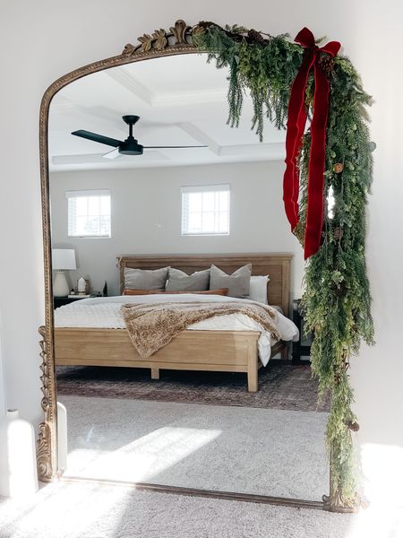All garland used is ON SALE! Holiday decor. Christmas garland. Christmas decor. Large mirror. Mirror garland. Bedroom holiday decor. Burgundy velvet ribbon. 

#LTKSeasonal #LTKunder50 #LTKhome
