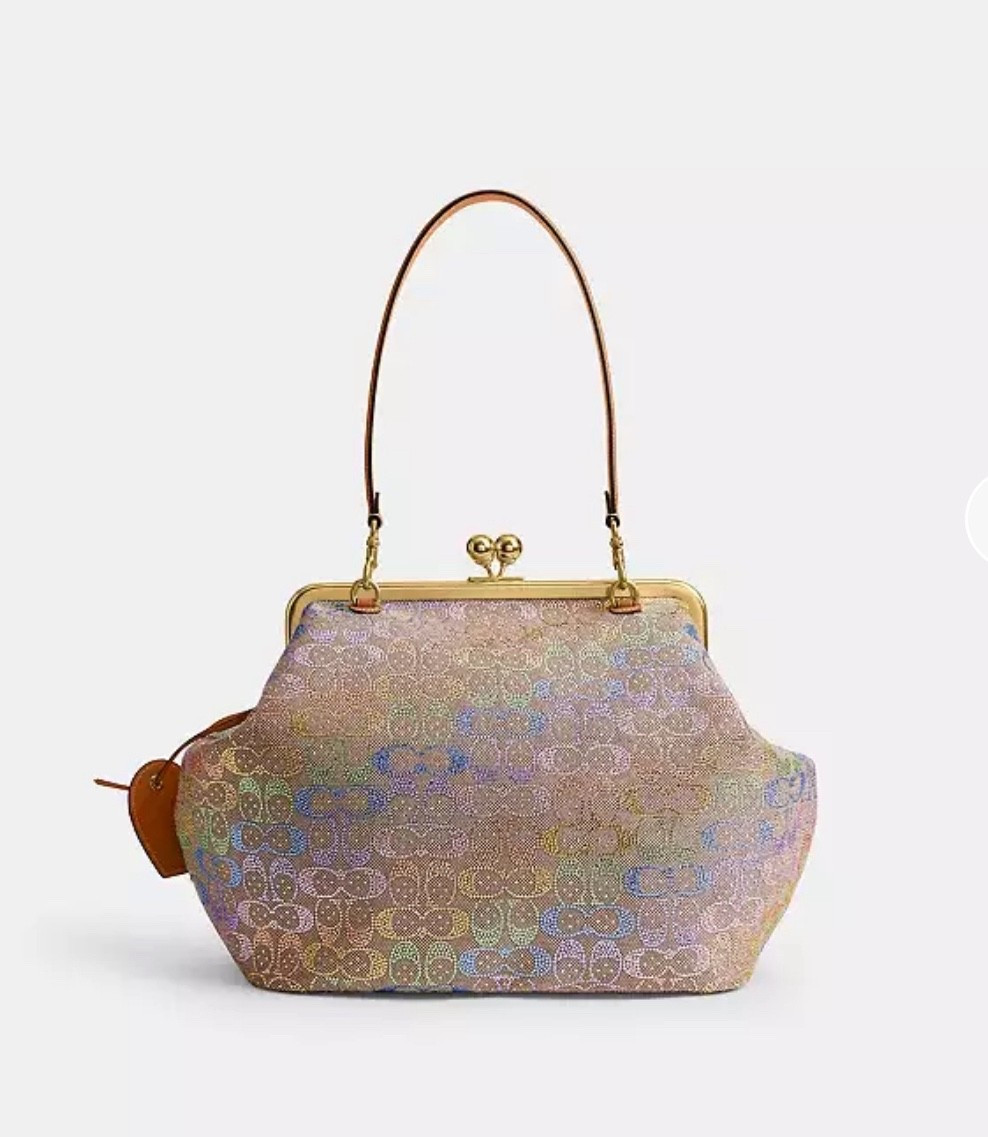Obsessed with this shimmer-finished frame bag! 🌈✨ It’s the perfect mix of classic and contemporary. Linking it for anyone who loves a standout accessory. 💛👜

Make sure you get this beautiful crystal rainbow coach Kisslock

#LTKmomlife #LTKSaleAlert #LTKHoliday