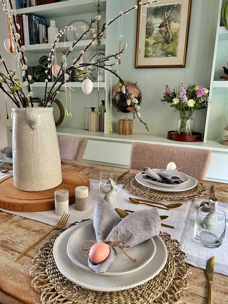 Easter table styling decorations with bunny napkins and rattan napkin rings, large white vase with faux flowers and sprigs for hanging decorations 

#LTKSeasonal #LTKhome #LTKfindsunder50