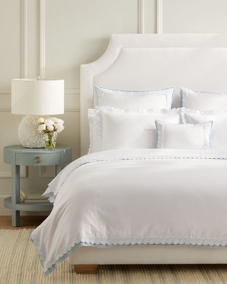 Blue and white bedding, scalloped duvet cover, white bed, upholstered bed frame blue nightstand coastal decor style 

#LTKstyletip #LTKhome #LTKFind