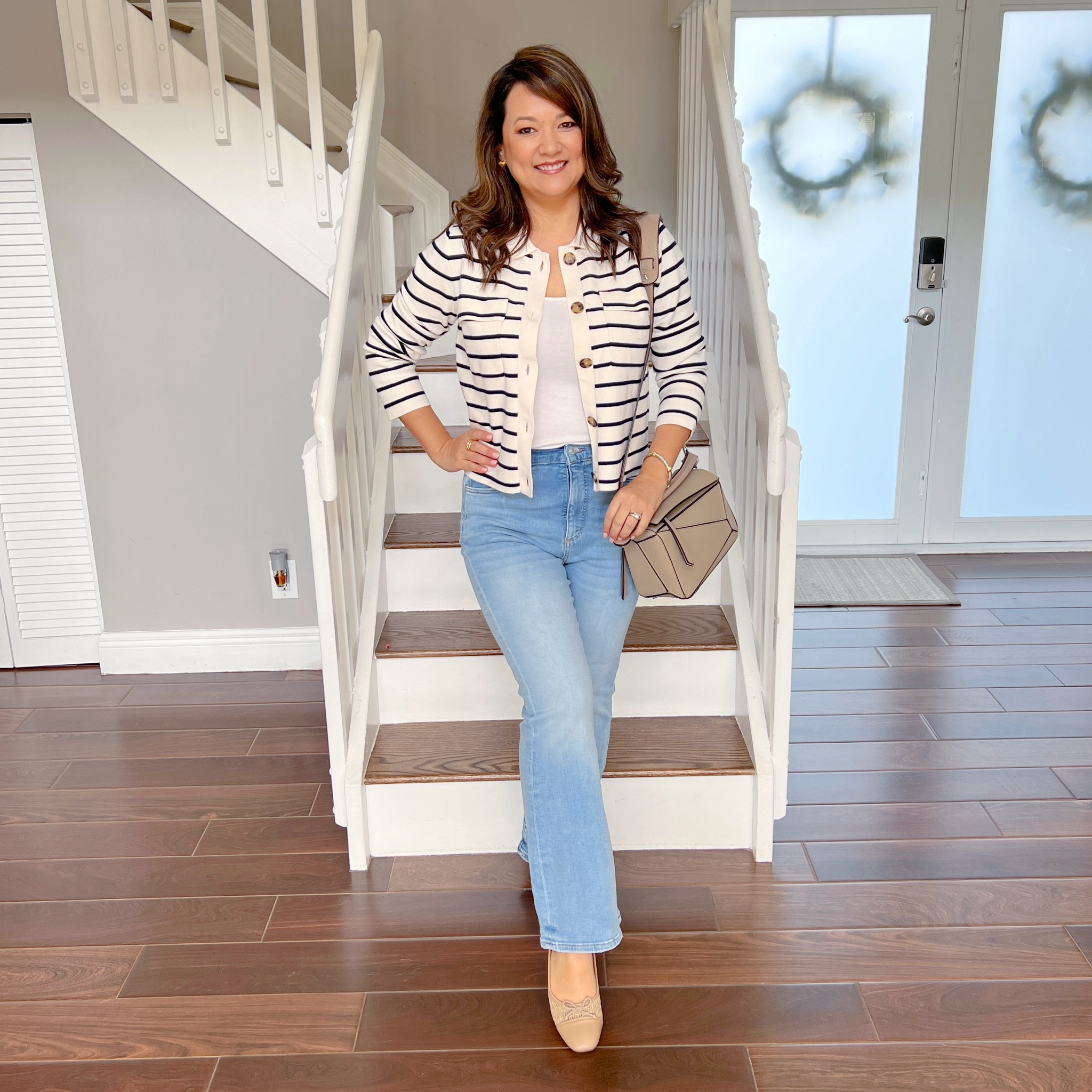 This outfit is featuring some of my new favorite finds. These light wash flare jeans are the perfect fit and now on sale for 30% off. This striped cardigan is a comfy versatile piece that can be worn casually or dress up for the office. Get it now for 40% off! This geometric bag is a great looks for less for under $70. Finally these cap toe ballet flats are so comfy and perfect for spring at under $18! 

#LTKsalealert #LTKover40 #LTKmidsize