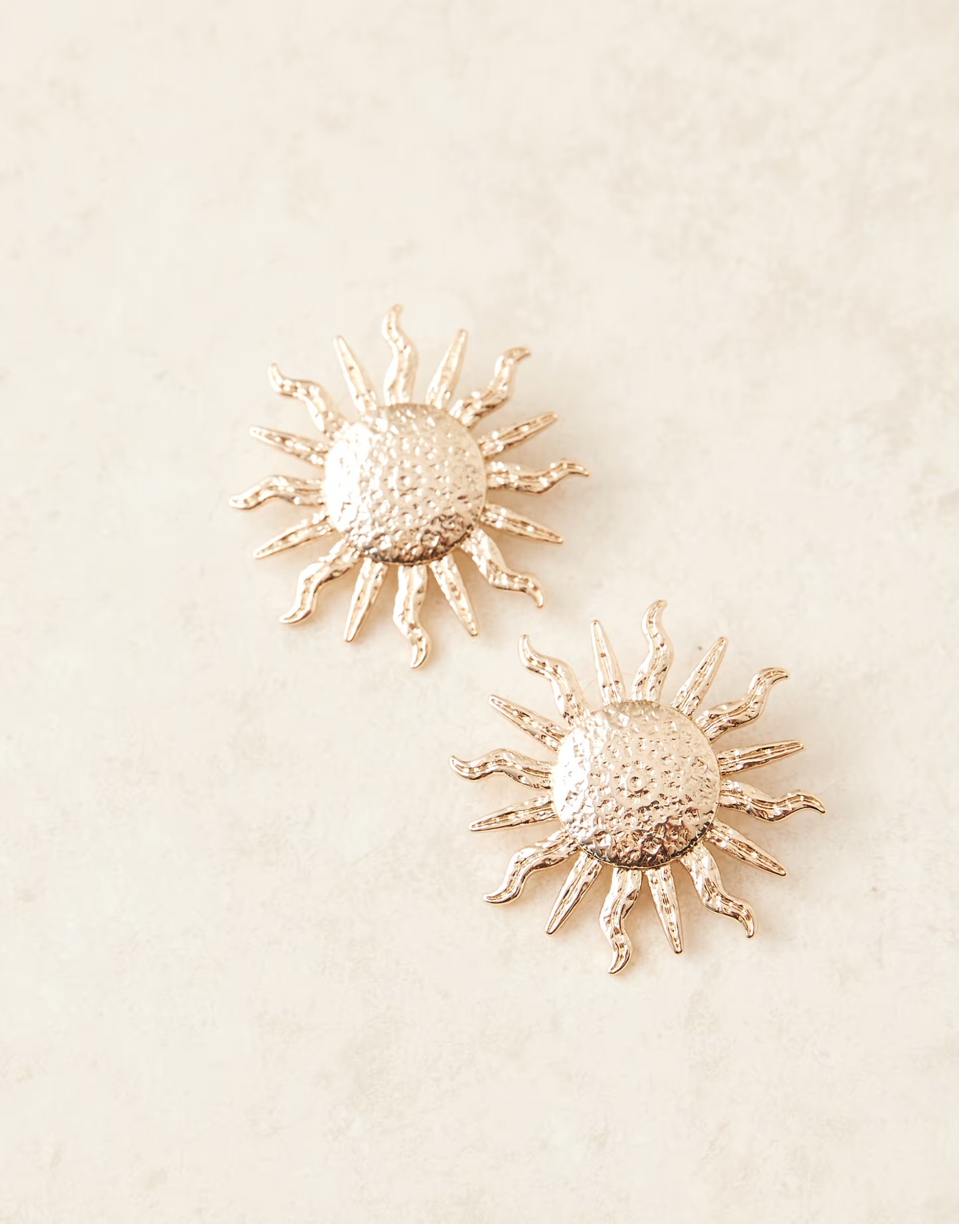 ASOS DESIGN large stud earrings in oversized sun design in gold tone | ASOS (Global)
