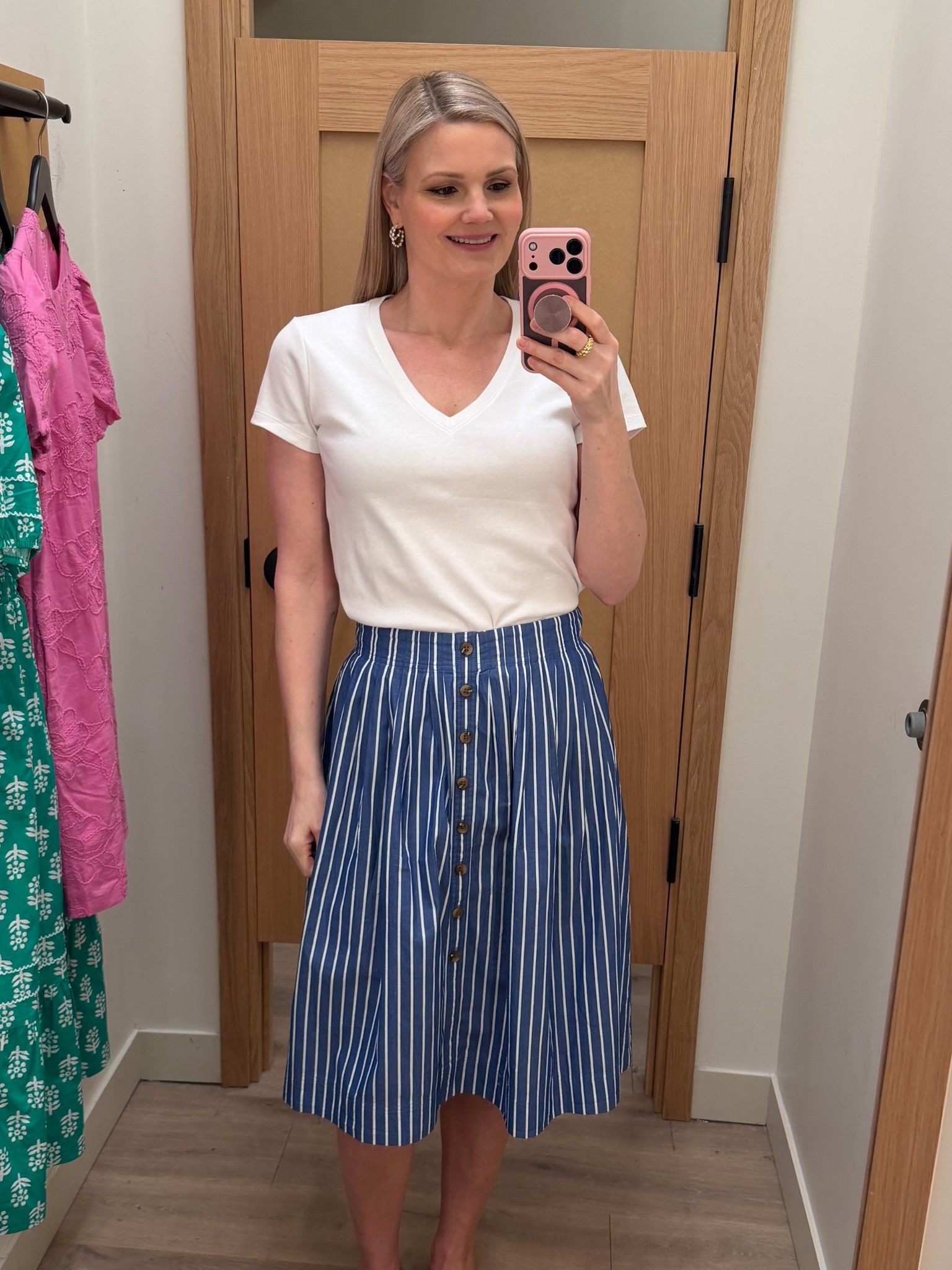 Striped midi skirt with elastic back. Runs big, I sized down one size. White v-neck tee shirt is so comfy! True to sizes. Both on sale  

#LTKOver40 #LTKootd #LTKTall