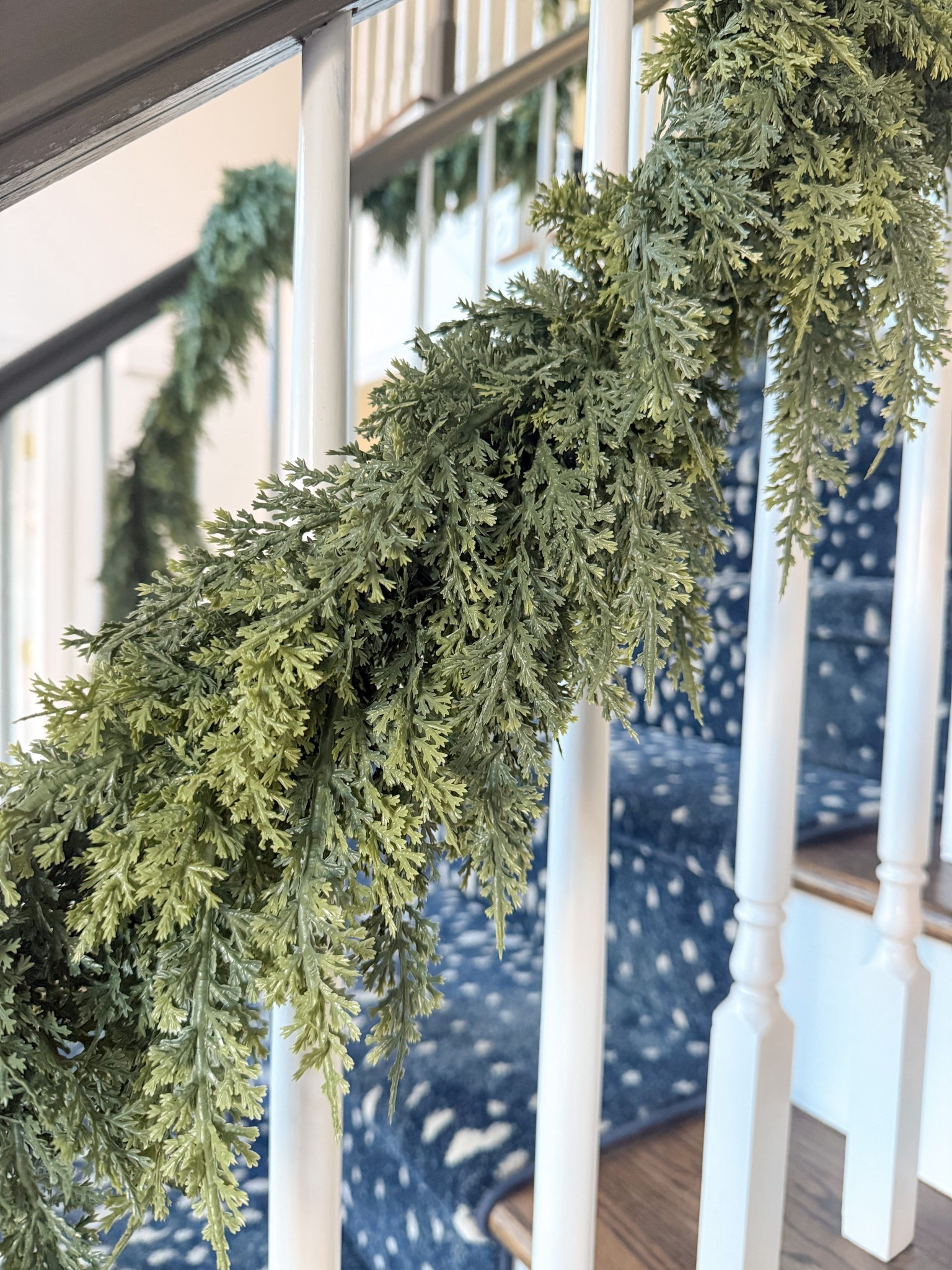 Real touch Christmas garland - 9 foot length is only $35 right now! 
Comes in 6’, 9’, 12’, and 15’ 
Layering two garlands definitely gives a fuller look, but I stuck with one for a simple look! 
Love how it’s coming together on my staircase! 

#LTKHoliday #LTKHome #LTKSaleAlert