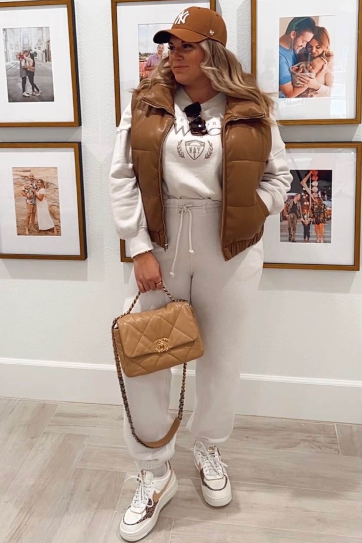 curvy sporty chic fall outfit! wearing size large in tan puffer vest, size large in NY sweatshirt, and size large in sweatpants. AF1 cheetah sneakers run .5 size big! 

#LTKSeasonal #LTKcurves #LTKunder100