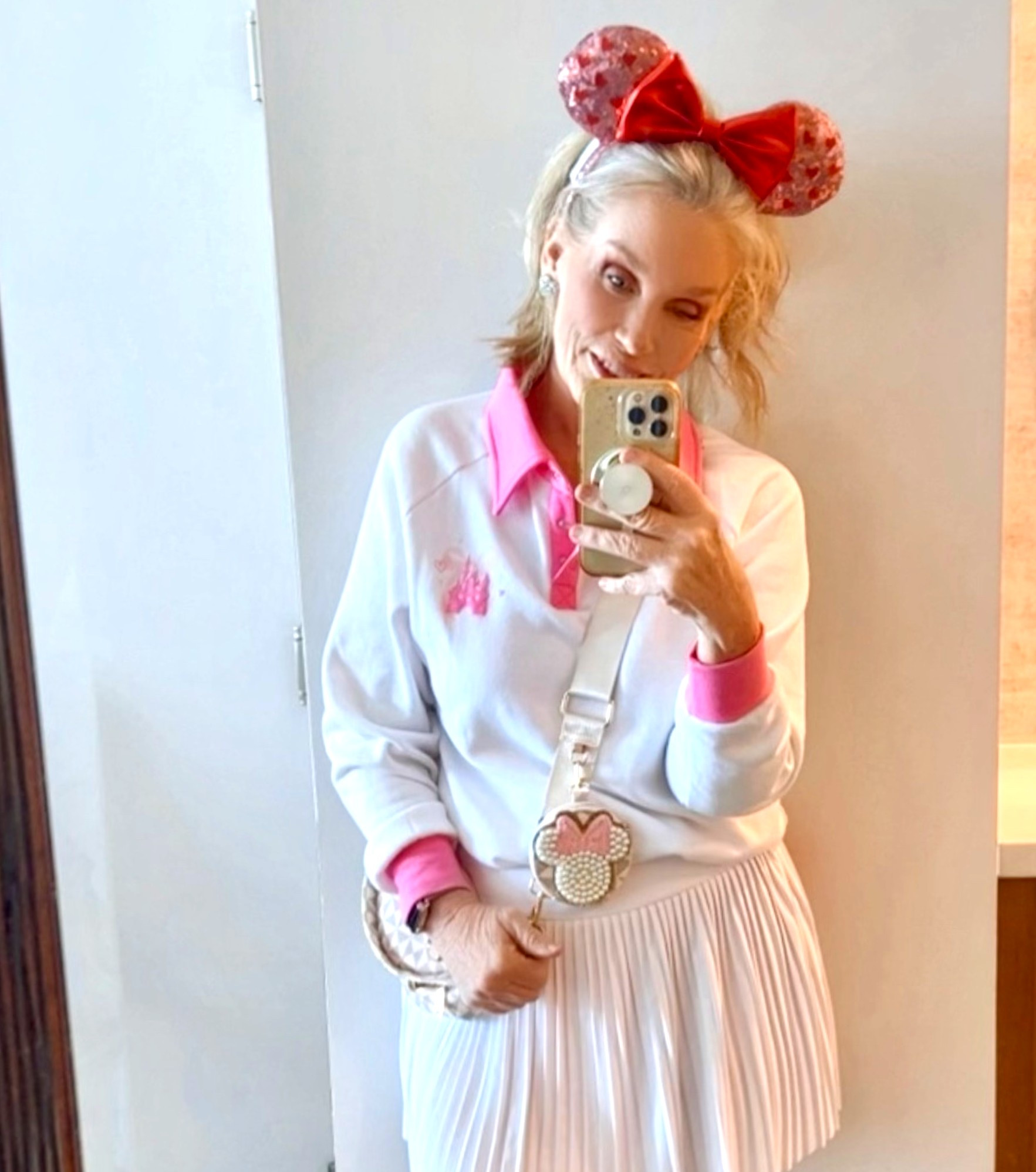 Headed to WDW for Valentine’s on a long Orlando overnight. One of my favorite things about my job is these fun opportunities! 
The sweetest pink and white “Happiest Place on Earth” polo, an easy Amazon pleated skort, and some heart Minnie ears complete the look! 

#LTKdayinmylife #LTKOver40 #LTKActive