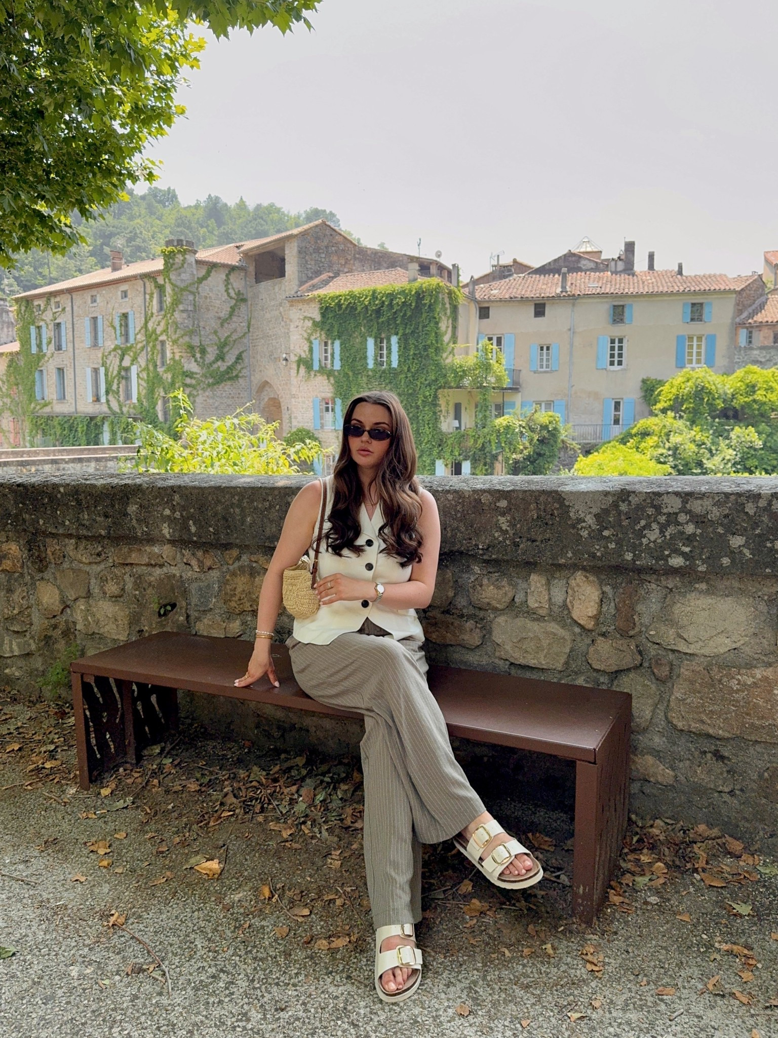 Summer holiday smart casual outfit idea - new look khaki & white striped linen drawstring trousers & cream sandals, Karen Millen white linen waistcoat, H&M raffia handbag, le specs tortoiseshell sunglasses

#LTKstyletip #LTKuk #LTKsummer