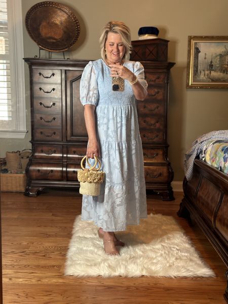 I am wearing a large in this smocked waist tier dress. I’m wearing my same clear/nude heels and paired it with a fun woven flower bucket bag!

#LTKFind #LTKwedding #LTKstyletip