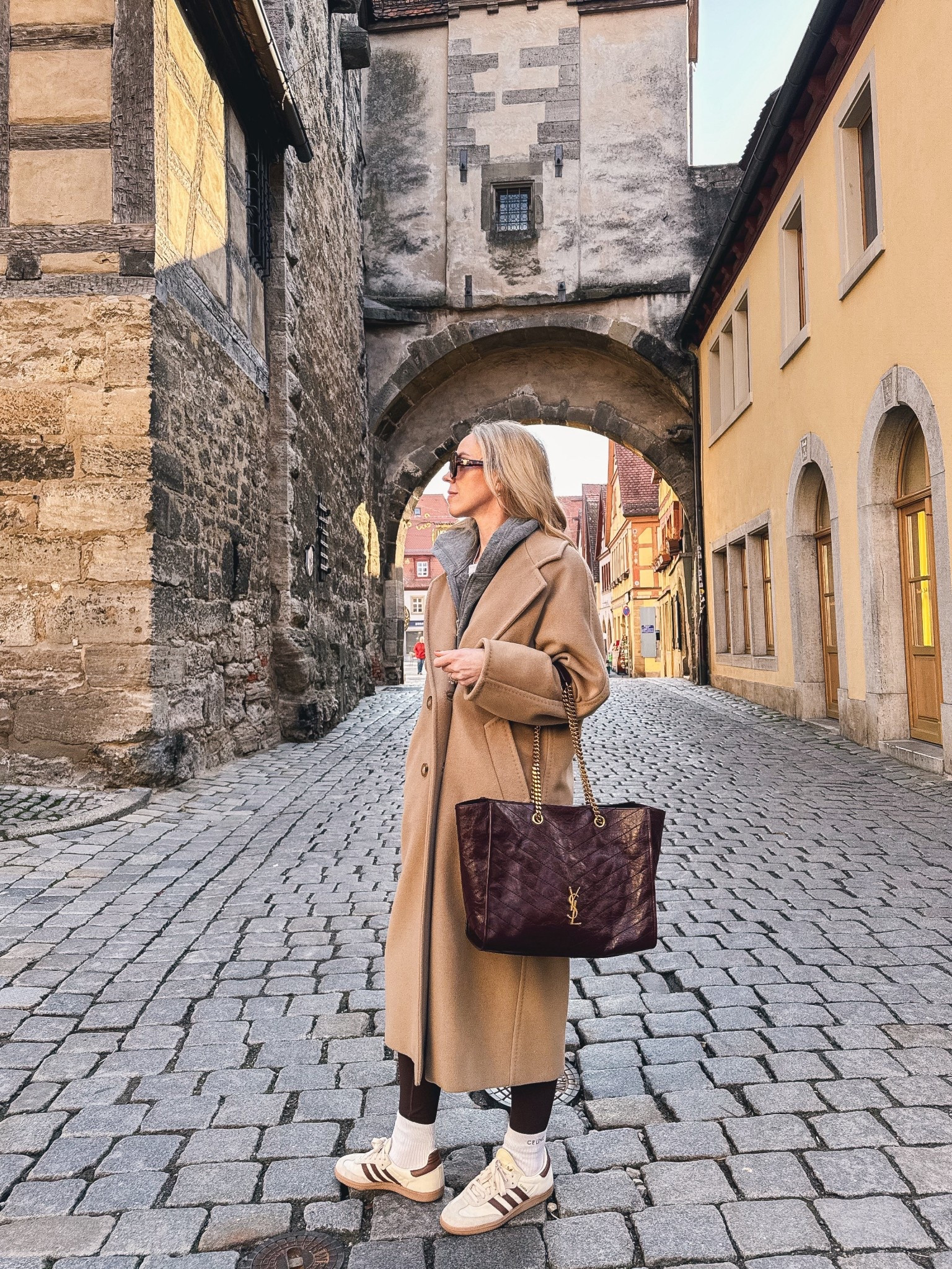 European vacation look, travel outfit, Max Mara camel coat, Adidas Samba sneakers, burgundy YSL tote bag 

#LTKTravel #LTKOver40 #LTKSeasonal
