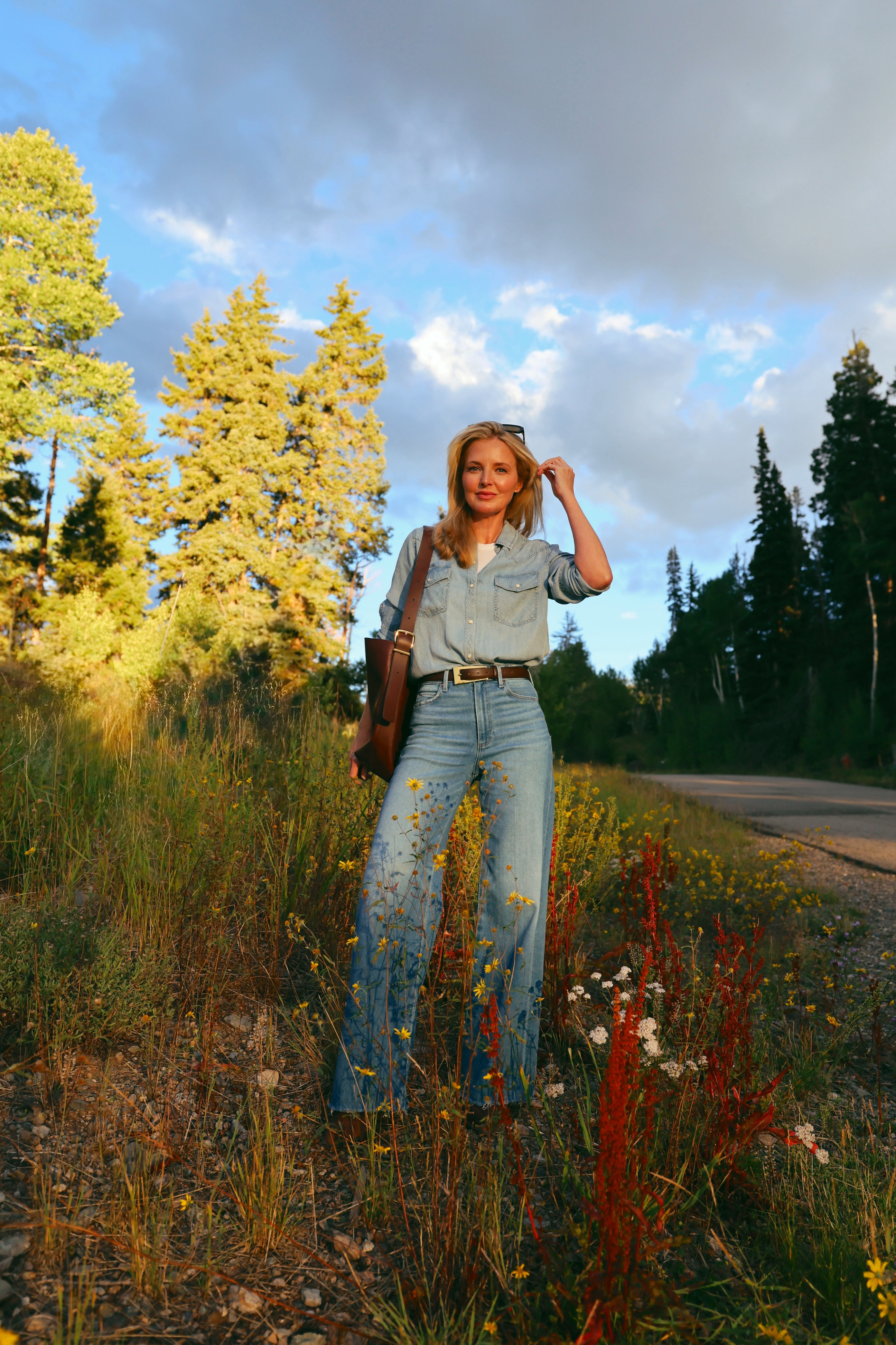 Wide leg jeans in golden hour light surrounded by wildflowers; this is what the Paige Anessa was made for!

The high rise and wide leg silhouette create the most beautiful long line from waist to hem. Styled with a Rails chambray top half tucked, brown leather belt, and a structured leather tote. The frayed hem adds just enough casual to keep it from feeling overdone.

#LTKgrwm #LTKootd #LTKOver40