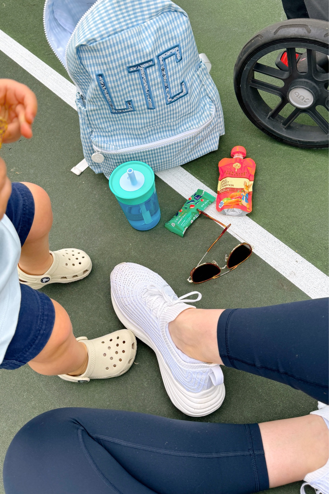 A handful of our favorite park, accessories,. Monogrammed, blue and white gingham backpack -completely wipeable. blue toddler cup with attached straw - spill proof. Neutral colored crocs, toddler boy classic shorts and T-shirt. 

#LTKkids #LTKSeasonal #LTKfamily