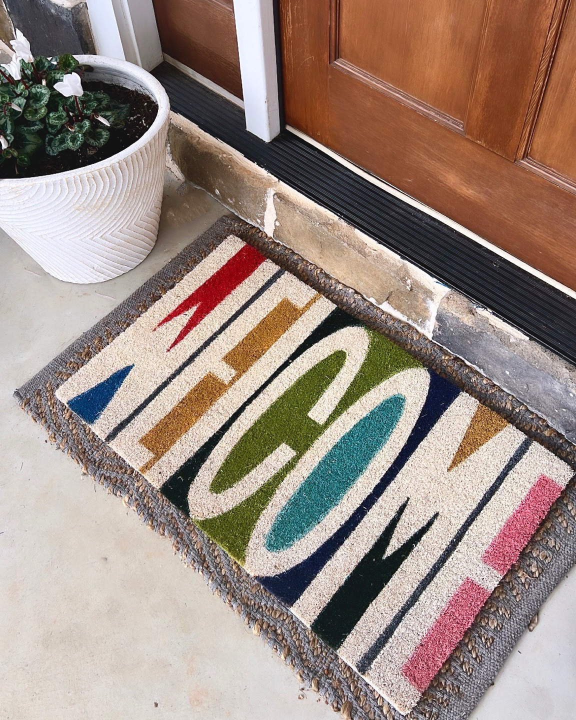 The happiest WELCOME mat. 🚪 🌈 

#LTKFind #LTKunder50 #LTKhome