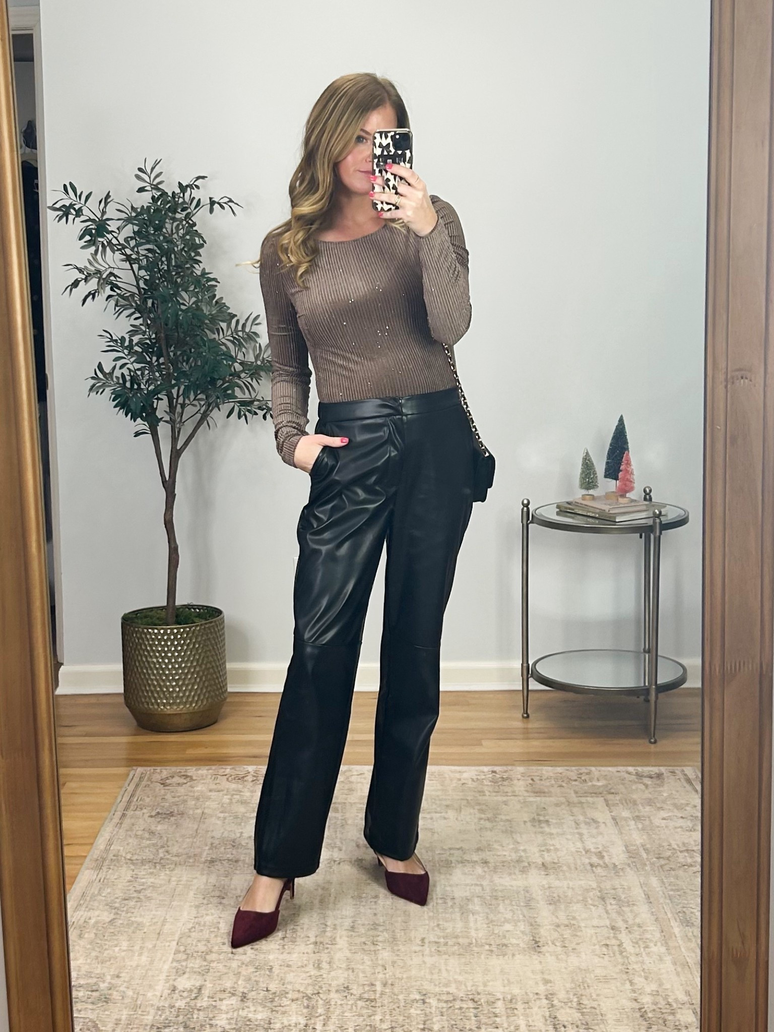 Holiday outfit! Love the subtle sparkle of this top! Velvet material with a low back paired with faux leather pants. Size M in both the top and pants! 

#LTKFindsUnder50 #LTKSeasonal #LTKHoliday