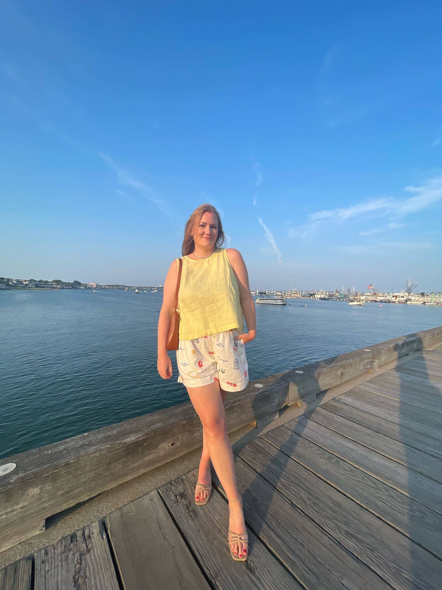 Beach vacation outfit inspo. Linen shirt, linen top, yellow linen top, linen shorts, brown shoulder bag, nude sandals, summer sandals, gold hand chain bracelet  

#LTKStyleTip #LTKSeasonal #LTKShoeCrush