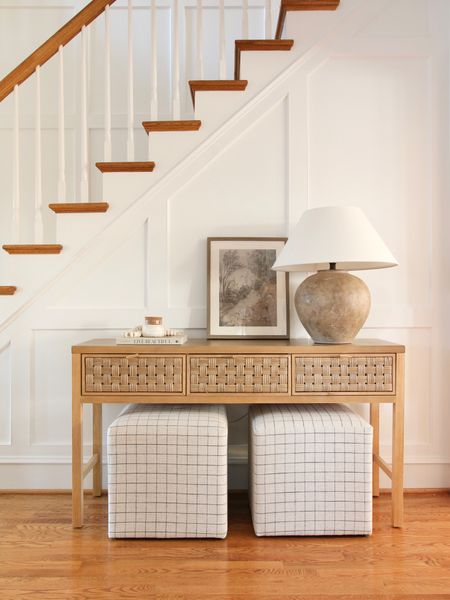 Some of my favorites below the staircase. The woven 3 drawer console table, upholstered cubes and framed wall art are from Target Studio McGee. The ceramic age textured table lamp is from Target Studio McGee 

#LTKstyletip #LTKFind #LTKhome
