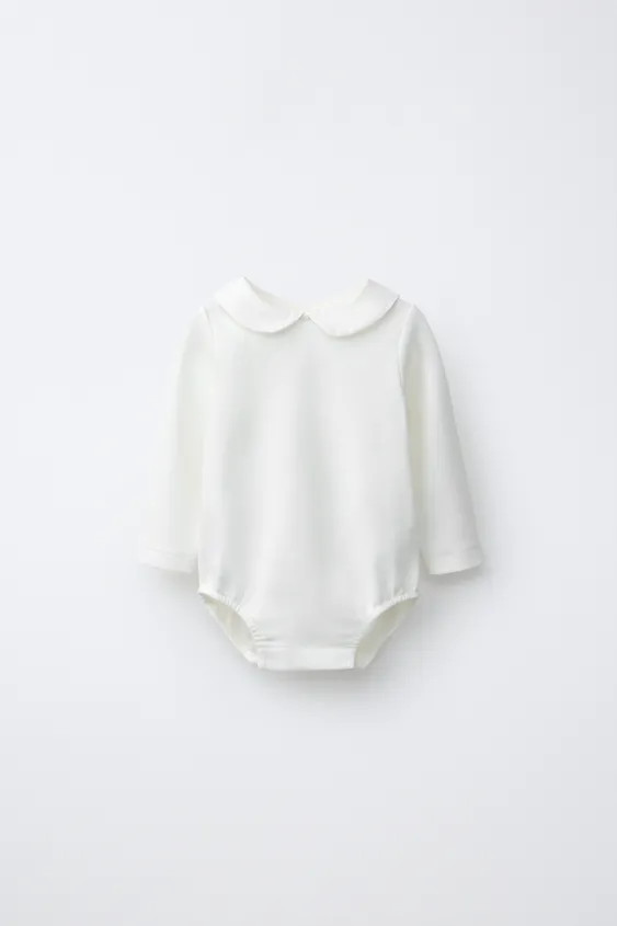 Bodysuit with a peter pan collar and long sleeves. Featuring a buttoned tear-drop opening at the ... | Zara UK