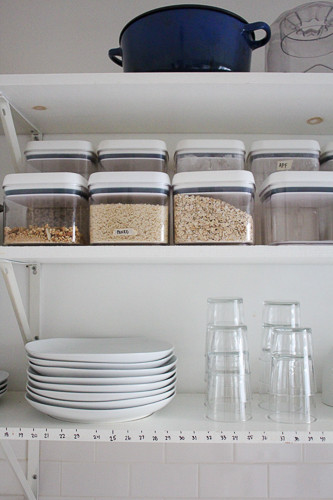 Clear pantry containers + simple white dishes + clean stacking glasses on an open kitchen shelf...LOVE 

 

#LTKHome #LTKFamily