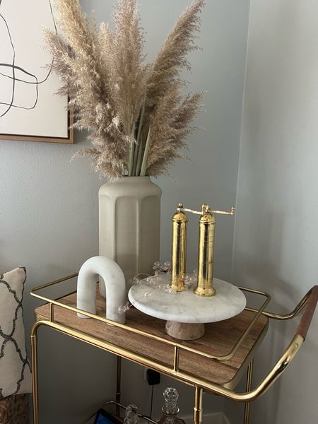 Large vase from Target / gold salt and pepper mills / marble sculpture / cake stand / bar cart / wine glasses / modern art. Home decor 

#LTKhome #LTKunder50 #LTKstyletip