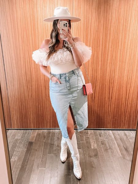 Western rodeo and country concert outfit inspo! Boots, denim skirt, spring bodysuit  