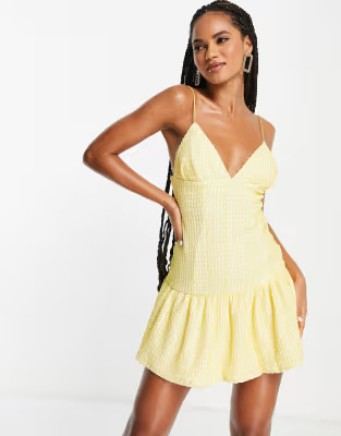 ASOS DESIGN cami plunge textured pep mini dress in yellow | ASOS (Global)