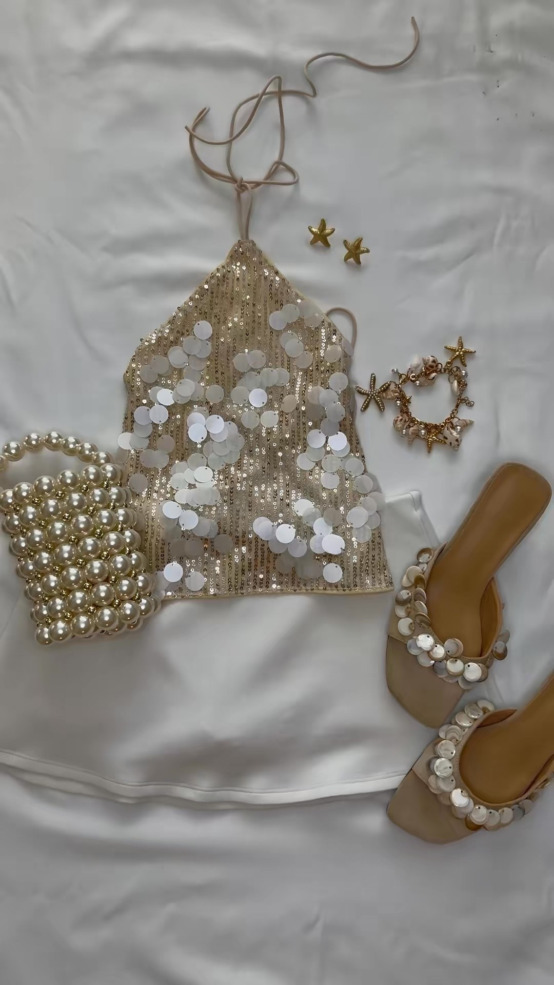 The Amazon finds that look so much more expensive than they are. 🤍 From the pearl bag to the sequin top and statement sandals, this is the perfect vacation outfit for beach dinners, resort nights, bridal events, or your next tropical getaway.

Amazon fashion, Amazon vacation outfit, beach vacation outfit, resort wear, European summer outfit, coastal style, pearl bag, pearl sandals, sequin top, beach dinner outfit, vacation style, honeymoon outfit, bridal vacation outfit, neutral outfit, summer outfit inspiration.

#LTKTravel