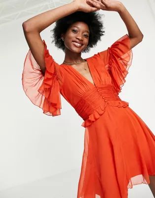ASOS DESIGN flutter sleeve mini dress with pleated waist and button detail in rust | ASOS (Global)