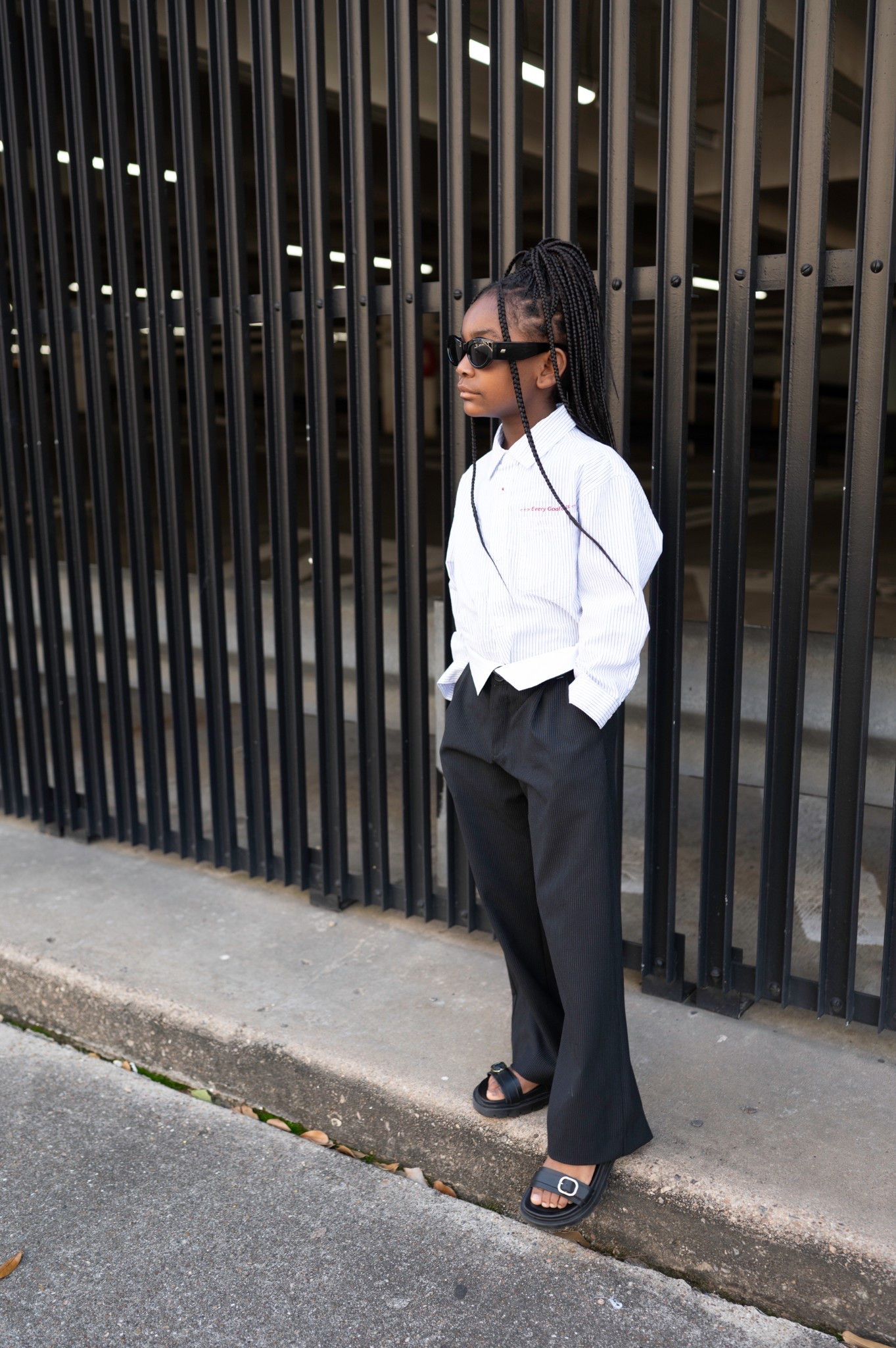 Girls spring break casual cool outfit: fold over trousers, button down, sandals, black sunglasses 

#LTKShoeCrush #LTKFamily #LTKKids