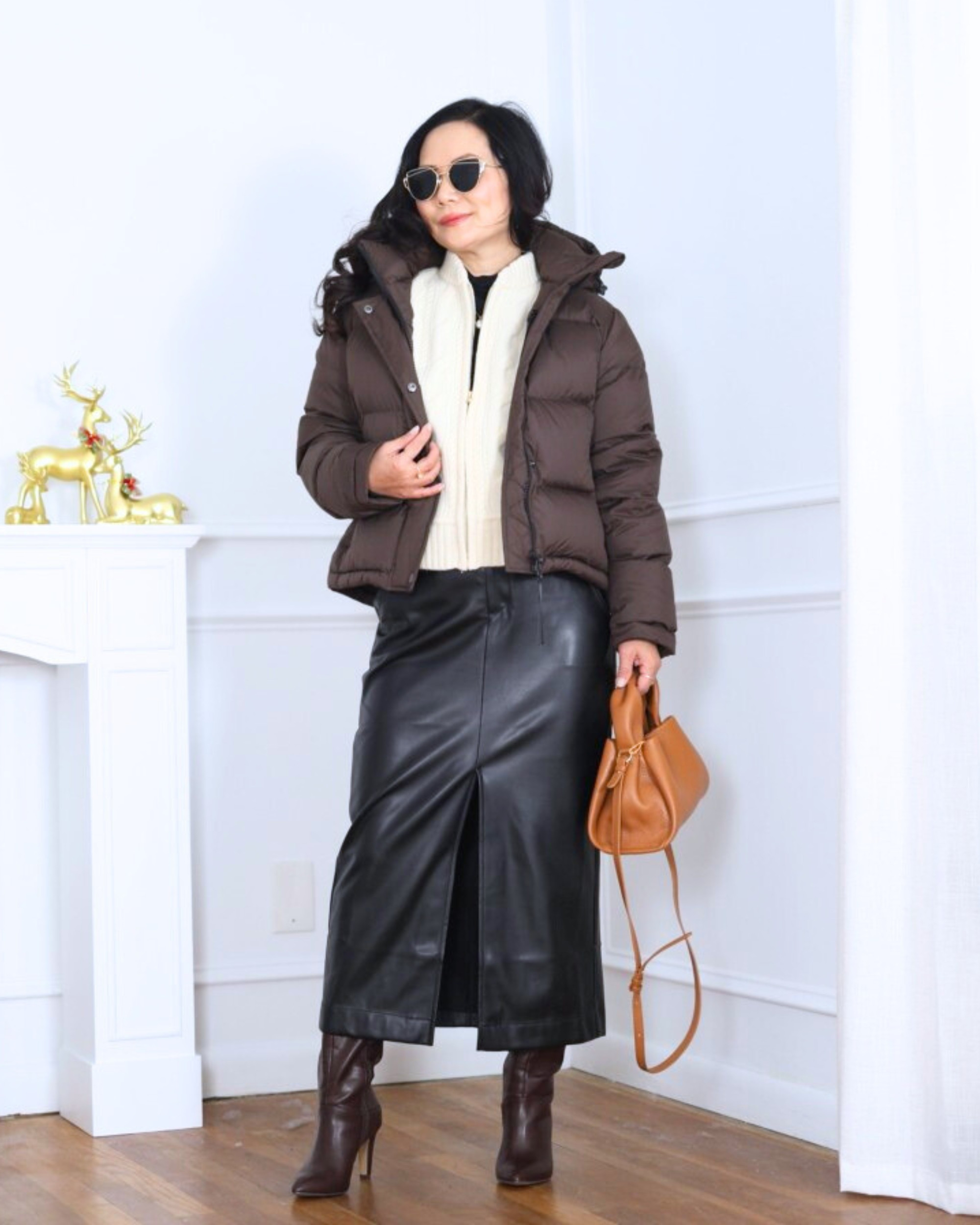 Layered my Quince puffer jacket over a J.Crew bomber, paired with a faux leather midi skirt and tall boots from Loft for a look that feels cozy, polished, and a little bit cool. I’m 5’2, wearing size XS.

#LTKootd #LTKOver40 #LTKPetite