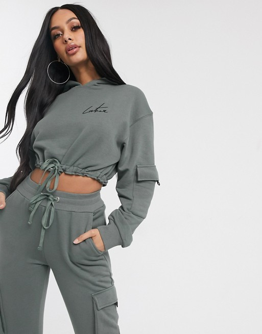 The Couture Club cropped motif drawstring hoody in khaki | ASOS UK