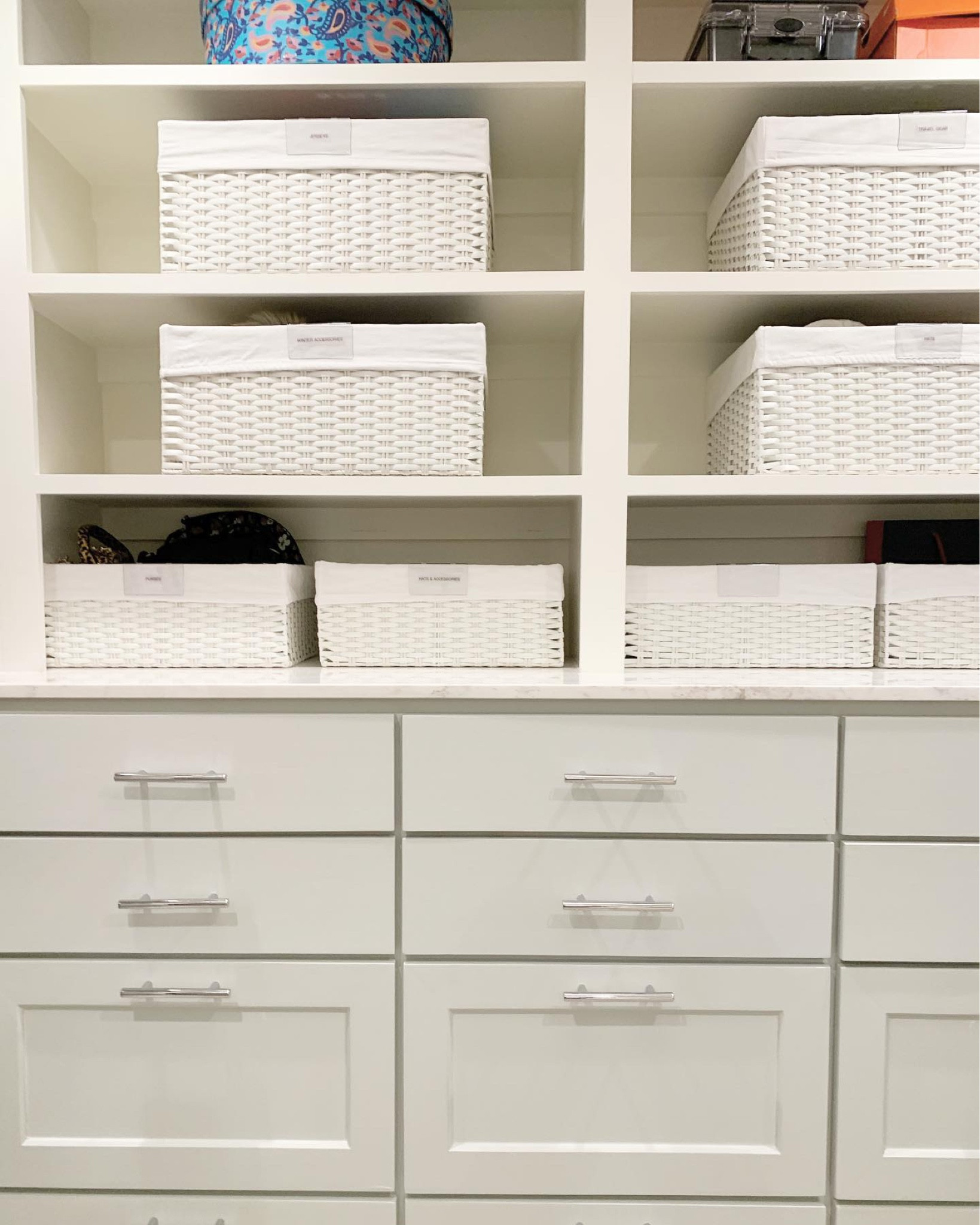 Primary closet storage and organization with baskets and label clips. 

#LTKHome #LTKFamily