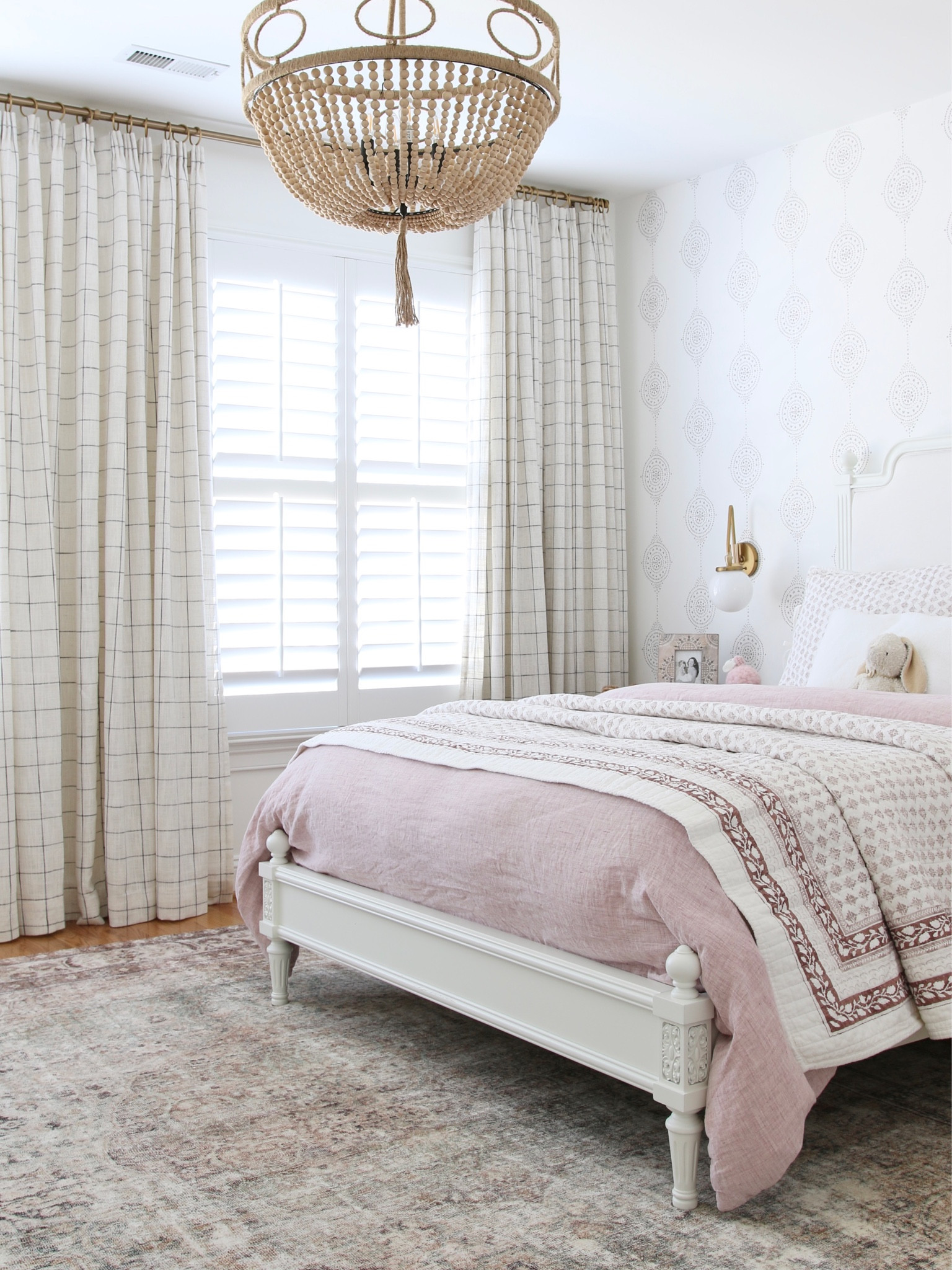 My original design for my girl’s room. I took Target Hearth and Hand drapes and pinch pleated them. I have a blog post detailing the process (stefanasilber.com) and all the supplied linked below. 
I had a wood, turned leg bed frame with an upholstered headboard. The bedding includes a flax linen duvet cover and cotton slub wood block print quilt and sham. 
I used Luna Stripe wallpaper from Serena and Lily, a wood beaded pendant and Loloi Margot rug

#LTKFind #LTKstyletip #LTKhome