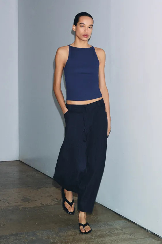 ZARA WOMAN COLLECTIONTrousers made from a lyocell blend yarn. Featuring a mid-waist with an elast... | Zara UK