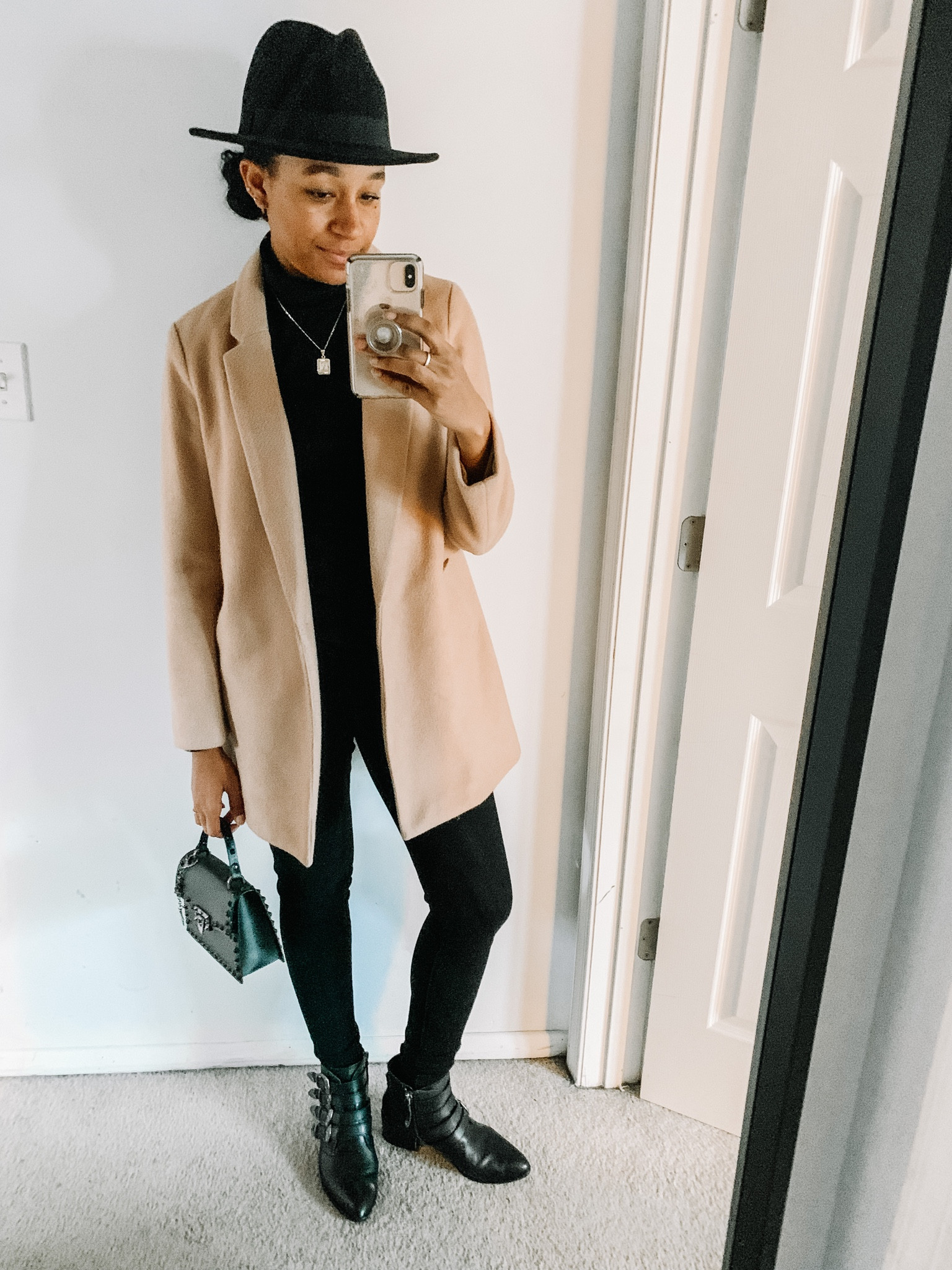 If you’re ever in a pinch. Grab black pants, black sweater and a really cool pair of shoes and you have an instant look. The came coat add the perfect contrast. 

#LTKstyletip #LTKunder100 #LTKSeasonal