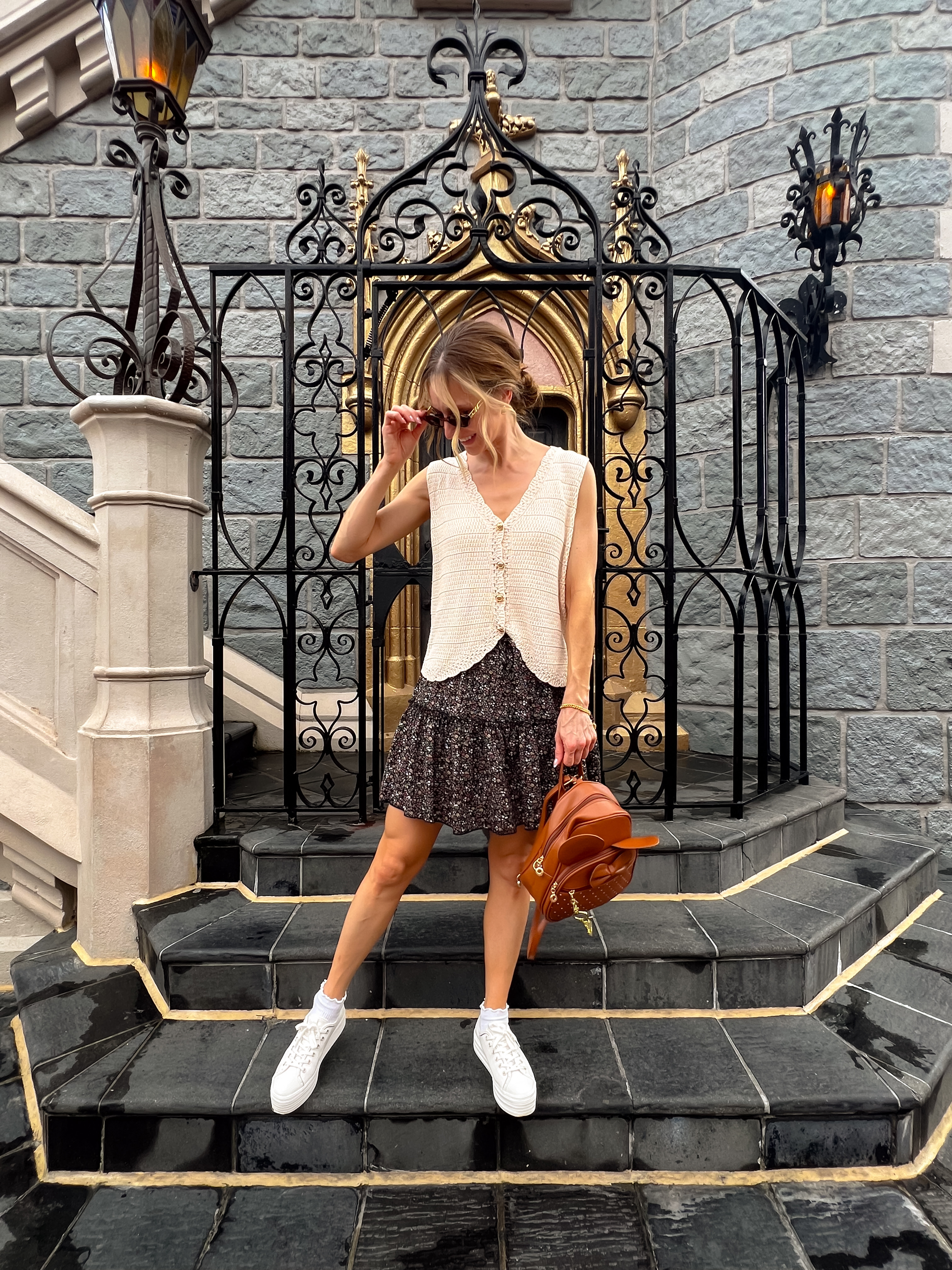 WIW to Disney in October. I added some biker shorts under the skirt for comfort and practicality. I'm in a size medium in the knit vest. The Keds sneakers fir TTS and were comfy enough to walk all around the park.
 

 #LTKootd #LTKSeasonal #LTKOver40