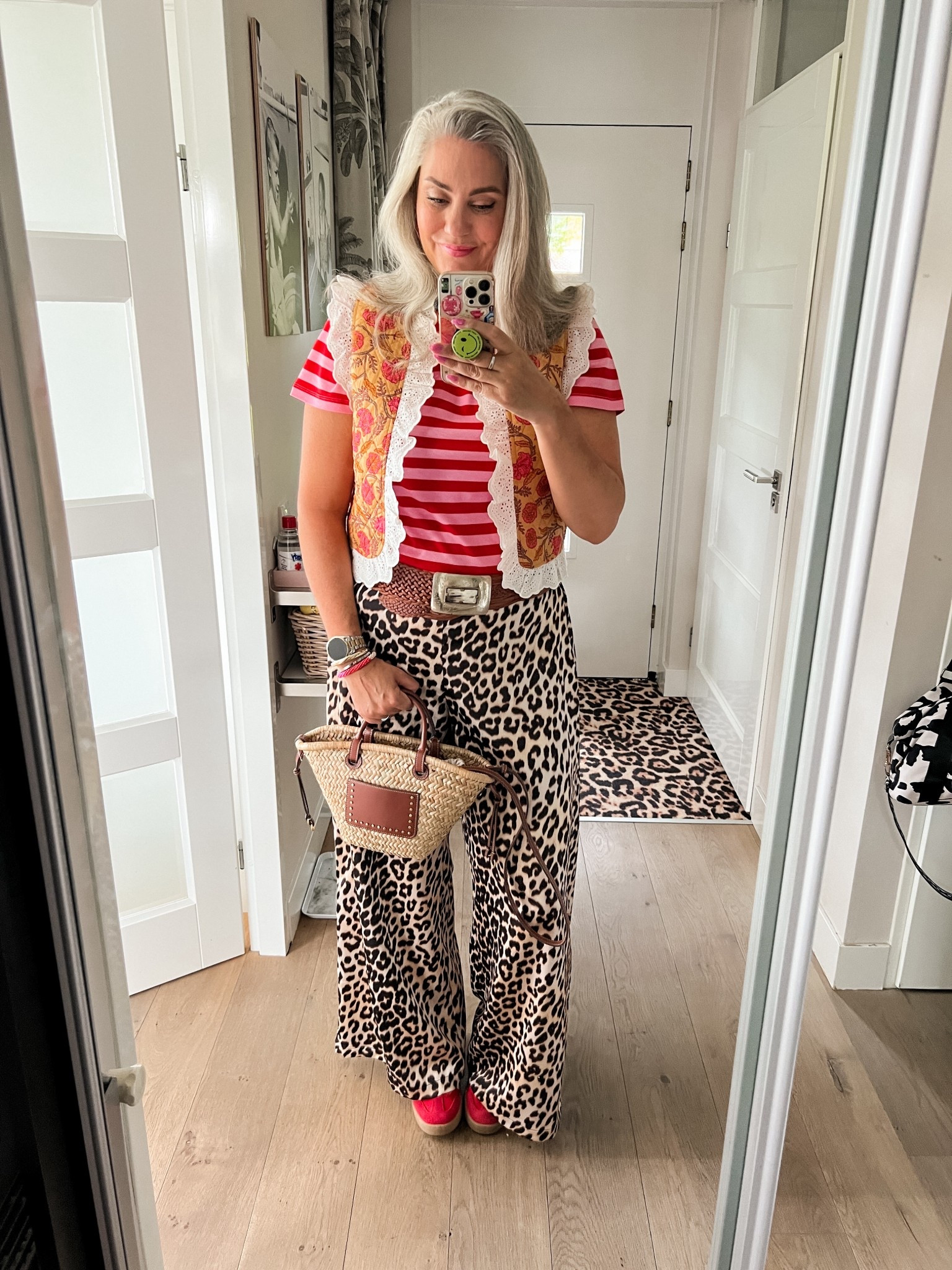 Ootd - Friday. Pink and red striped t-shirt (old H&M), yellow printed vest with broderie details (My Jewellery, L), leopard trousers (Shoeby, xl), red suede sneakers, straw purse, braided leather Y2K belt  

#LTKeurope #LTKnederlands #LTKsummer
