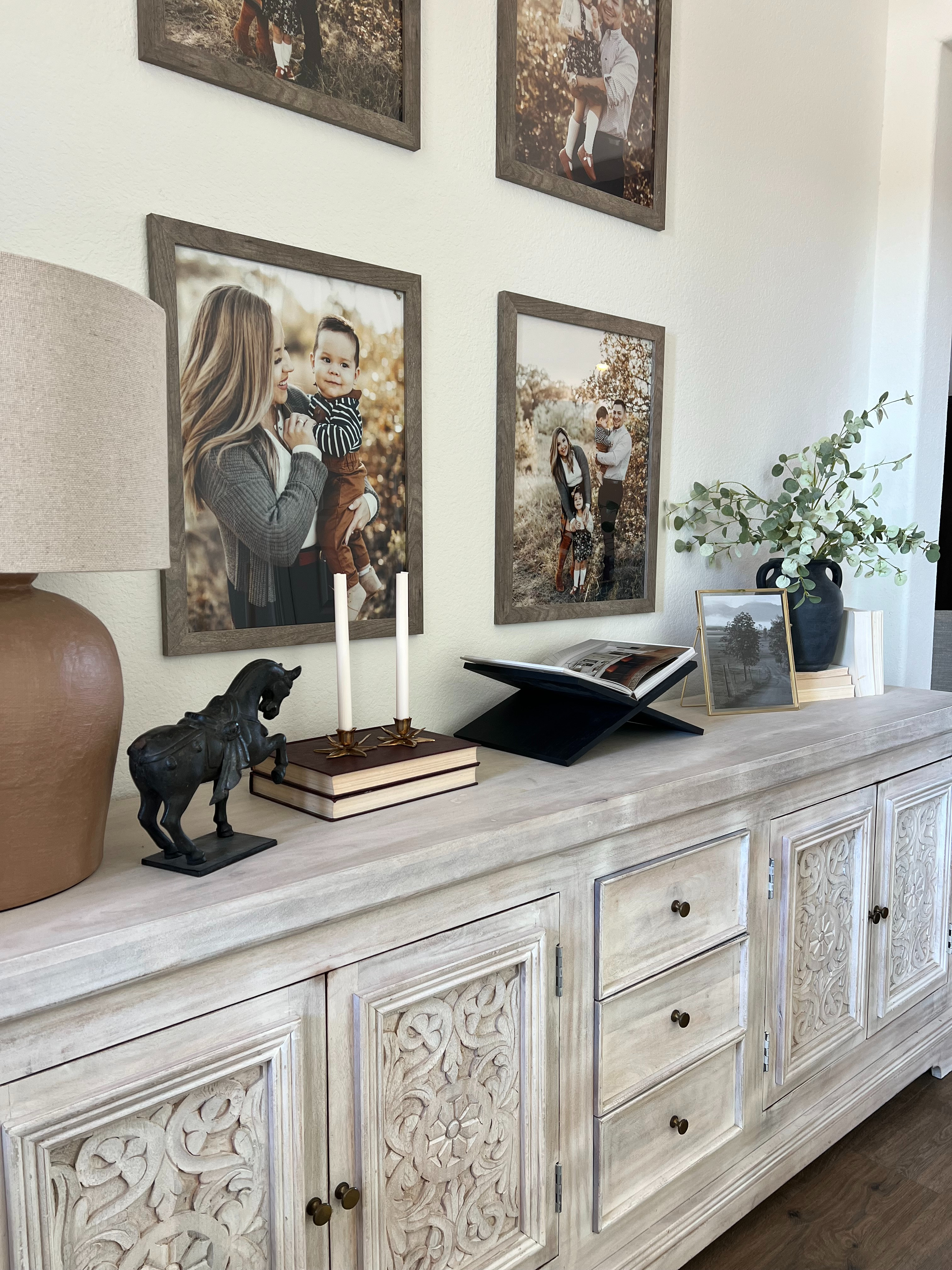 Entryway decor | Entryway inspiration | Traditional home | Transitional home | Collected home | Family photo wall | Gallery wall | Console styling | Sideboard decor | Vintage inspired decor | Warm neutral home | Brass decor | Coffee table books | Ceramic vase | Cozy home | Home styling | Nancy Meyers style 

 #LTKstorytime #LTKHome #LTKSaleAlert
