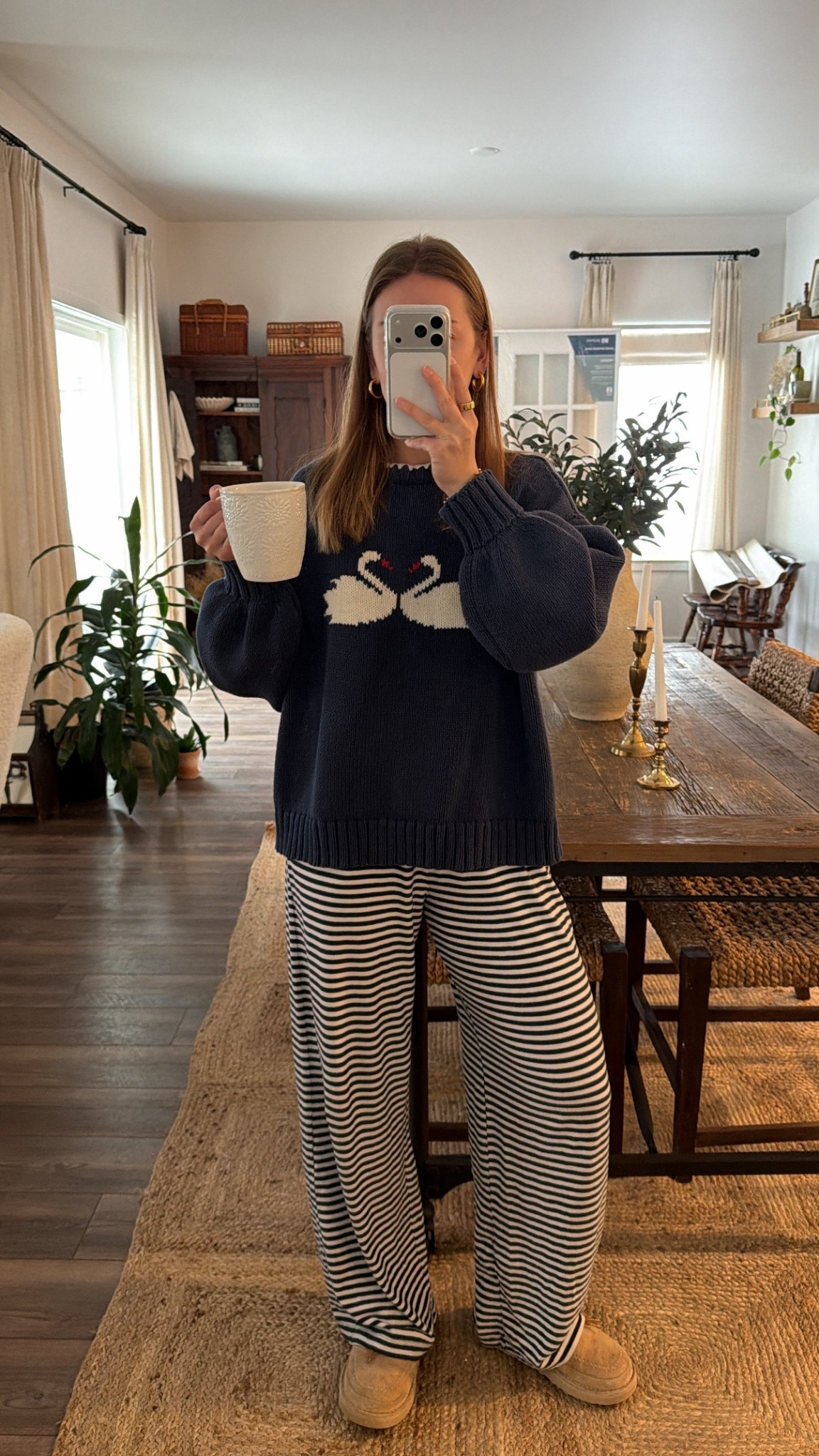 2/19/26 Cozy morning lounge look 🦢 I’m wearing my Princess Polly swan sweater (the cutest little winter detail) with my Abercrombie navy striped lounge pants — such a soft, easy combo for slow mornings at home. Effortless, comfy, and still feels put together.

#LTKootd #LTKmorningroutine