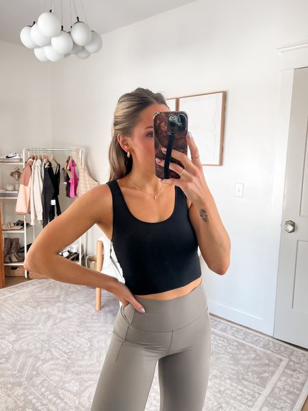 Are you kidding me with this top!! It’s SO GOOD. 

Great coverage! 👏🏻 and so comfortable! Wearing xs in the tank & small in leggings!

#LTKfindsunder100 #LTKfitness #LTKfindsunder50