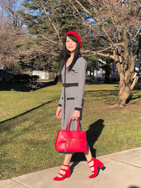 You can’t go wrong with a timeless, classic black/white houndstooth print and bright red accessories! I’m loving the straight, midi style of this dress, the contrasting trim, and the marble-like buttons. The closed decorative buttons extend to mid thigh, with a slit opening below. The fit is straight but comfortable, not a constricting body-con.  The material is soft with stretch and lightweight for spring!