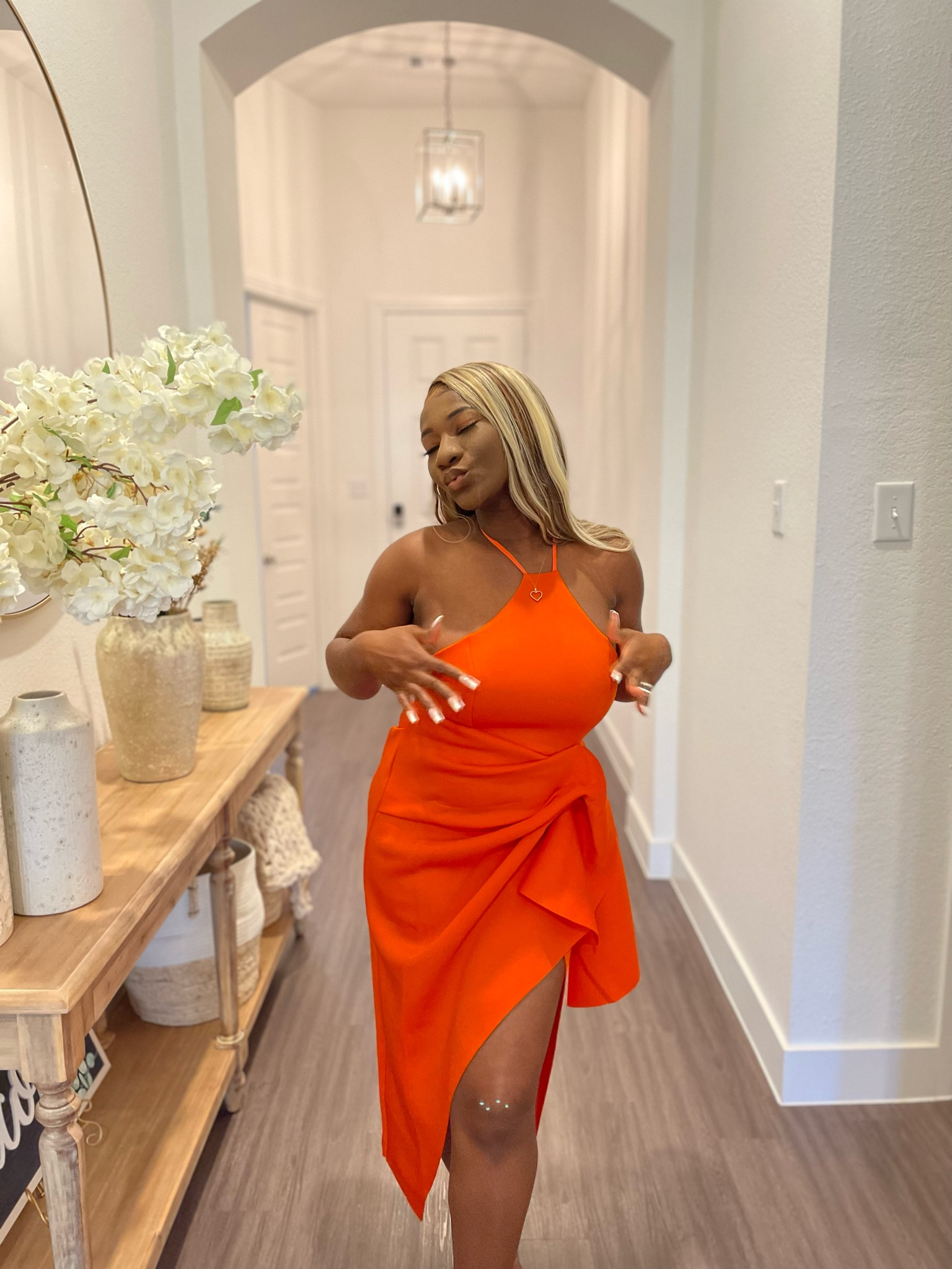 ASOS high neck strappy back pencil dress is flame orange.

More pregnancy related fashion. I wore this dress for my birthday while I was 4 months pregnant. 

#LTKstyletip #LTKfindsunder100 #LTKsalealert
