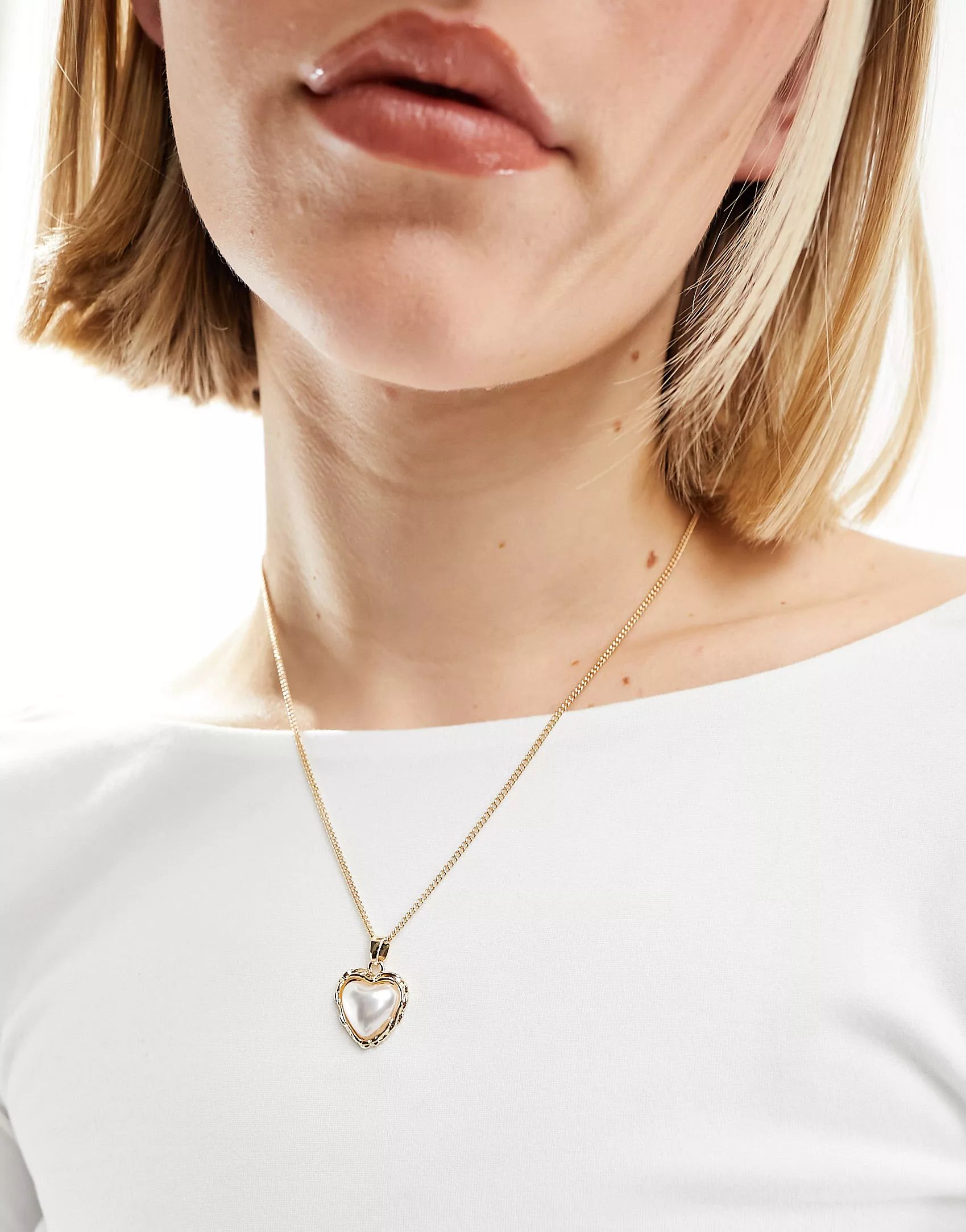 ASOS DESIGN necklace with faux pearl heart pendant in gold tone | ASOS (Global)